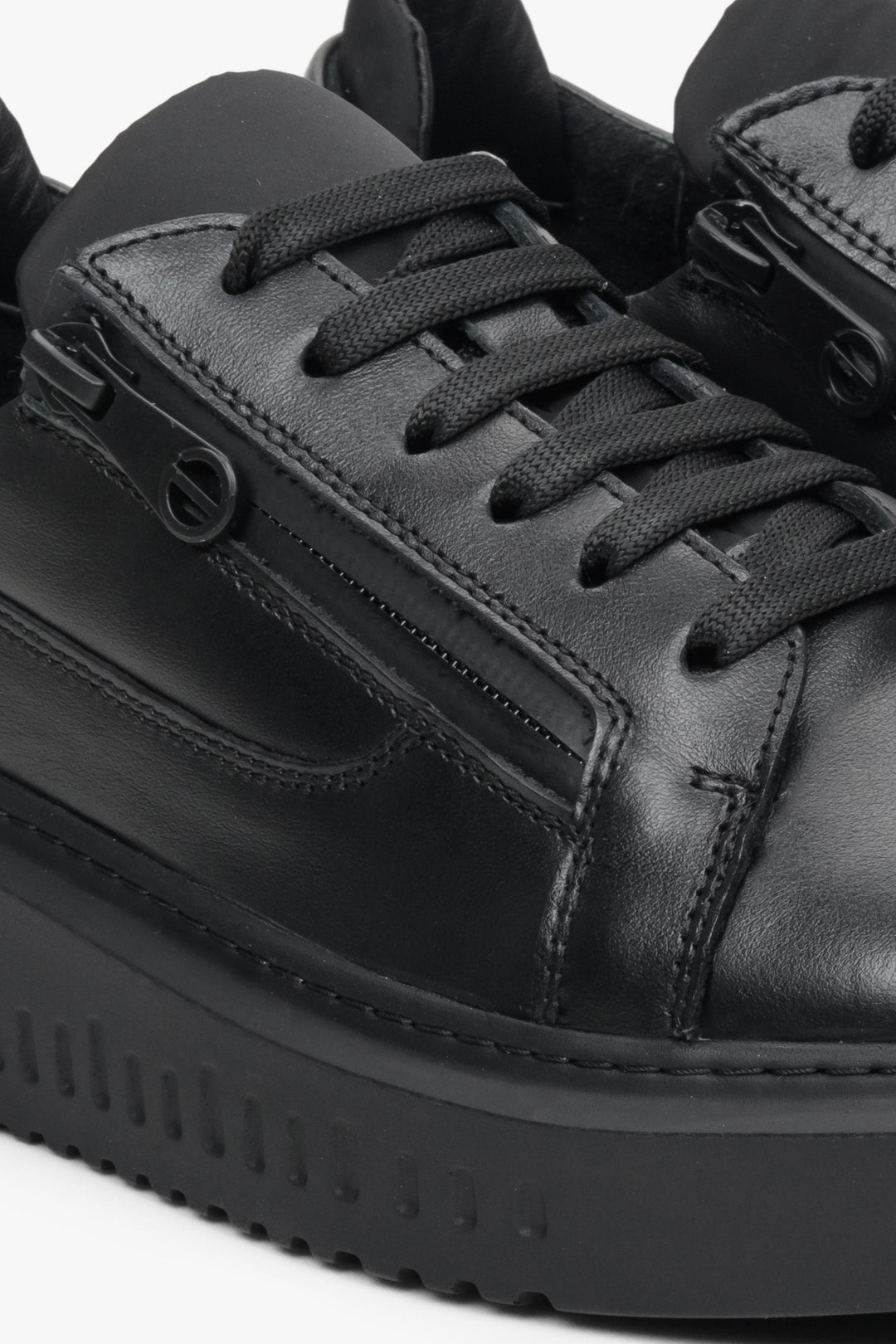 Leather, women's black sneakers by Estro with a flexible sole - close-up of the details.