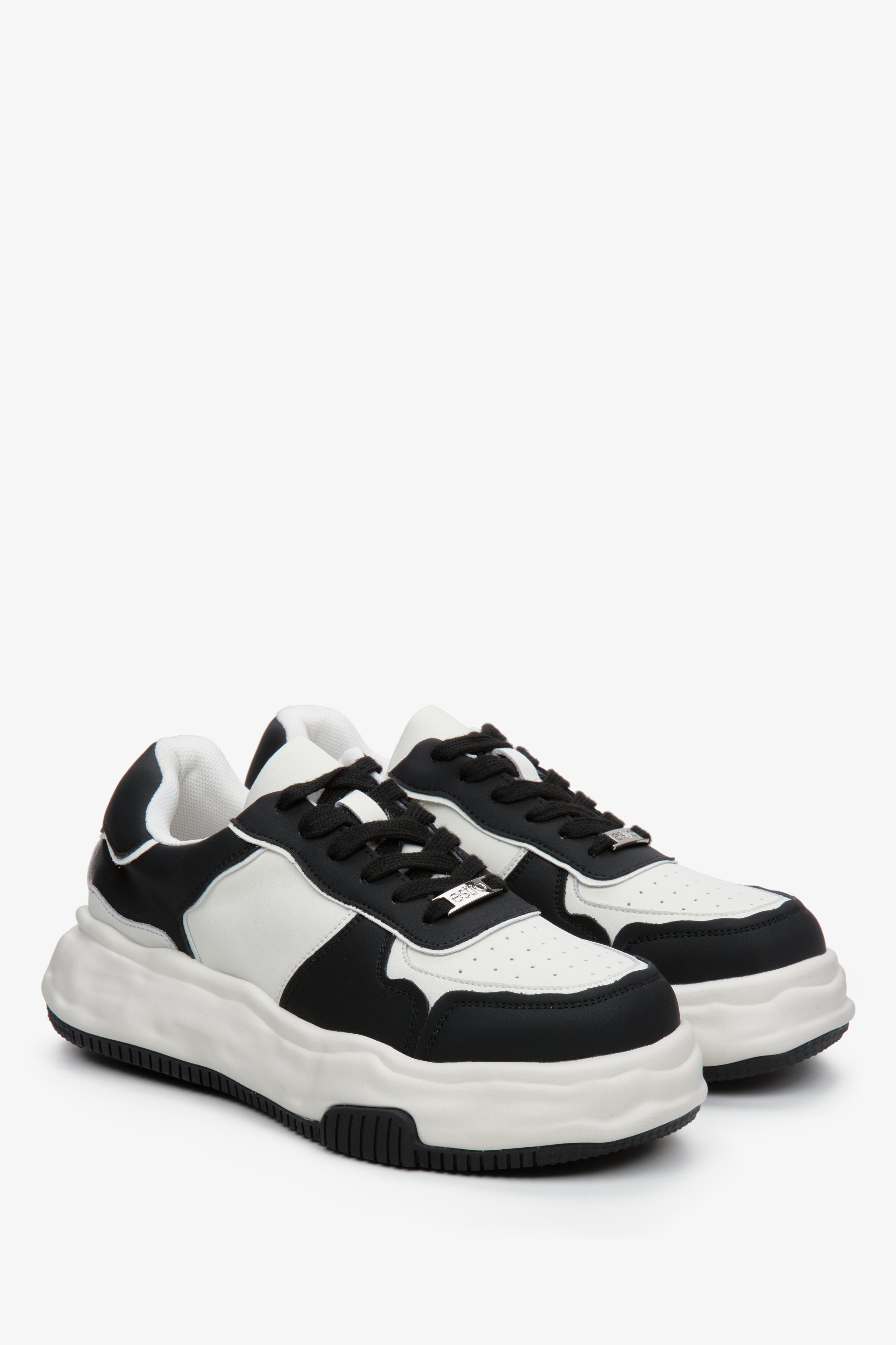 Women's black and white sneakers by Estro.