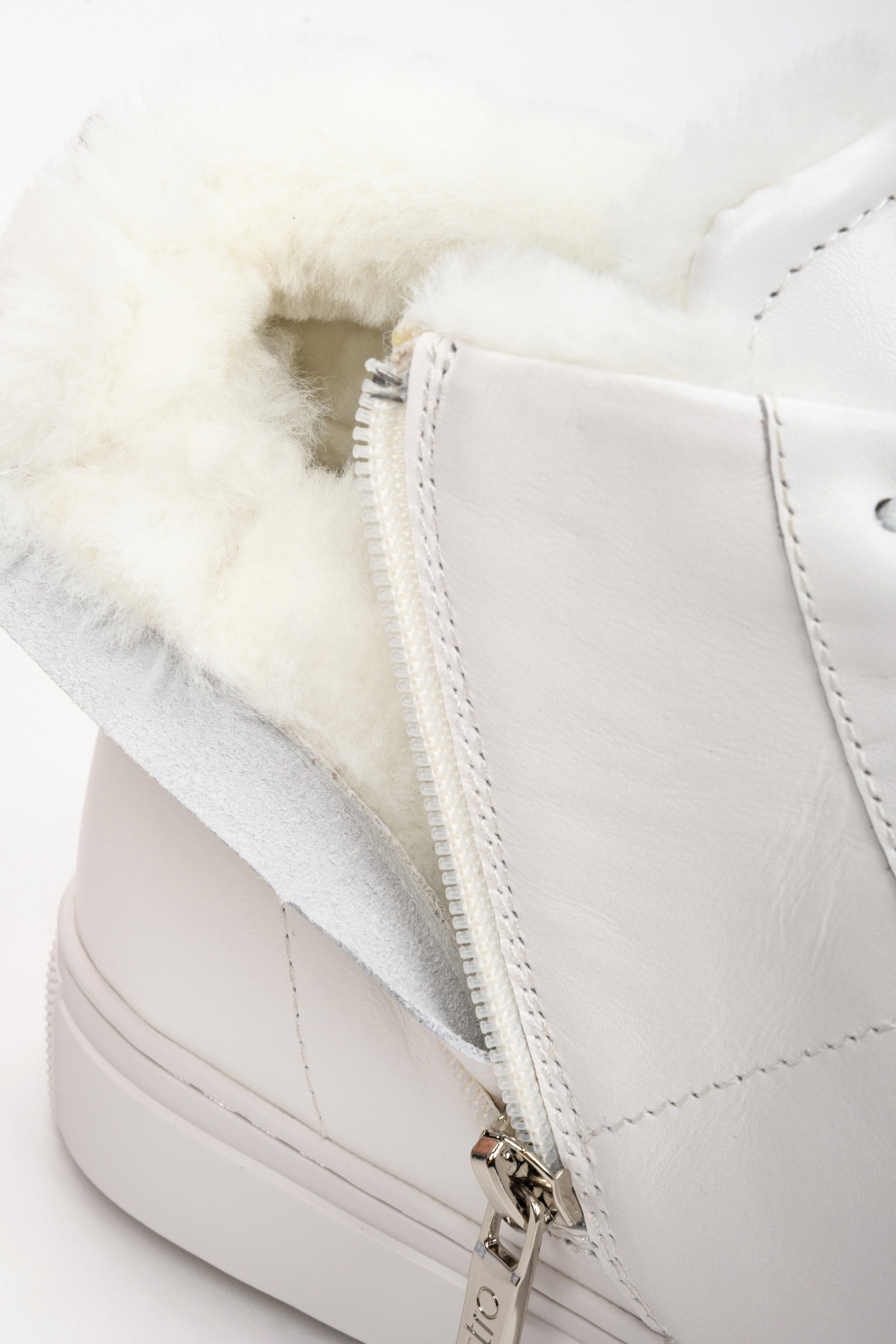 Women's white winter sneakers - close-up on the soft shoe lining.