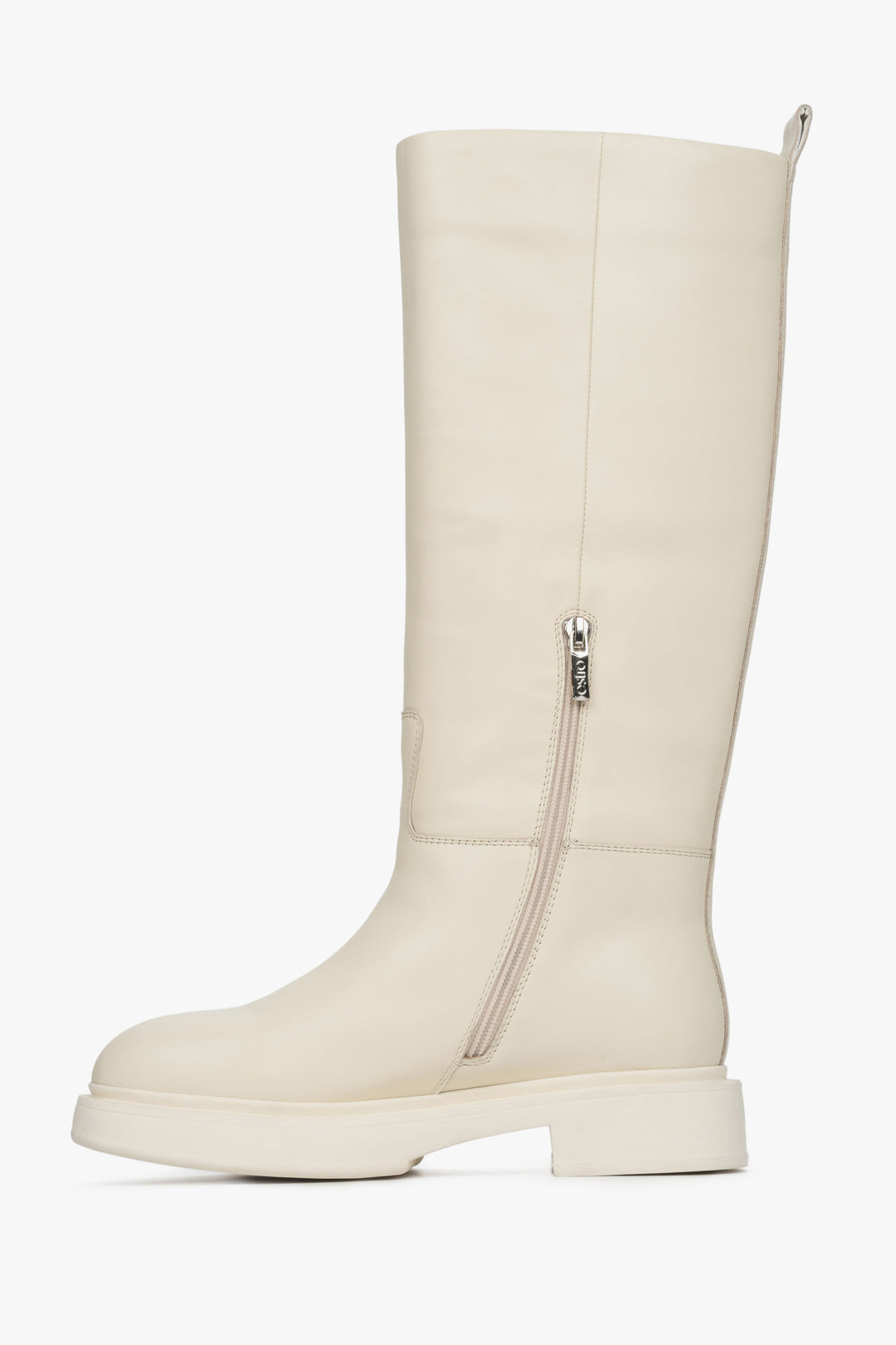 Women's high beige winter boots made of natural leather by Estro - close-up of the inner part of the seam of the boot.