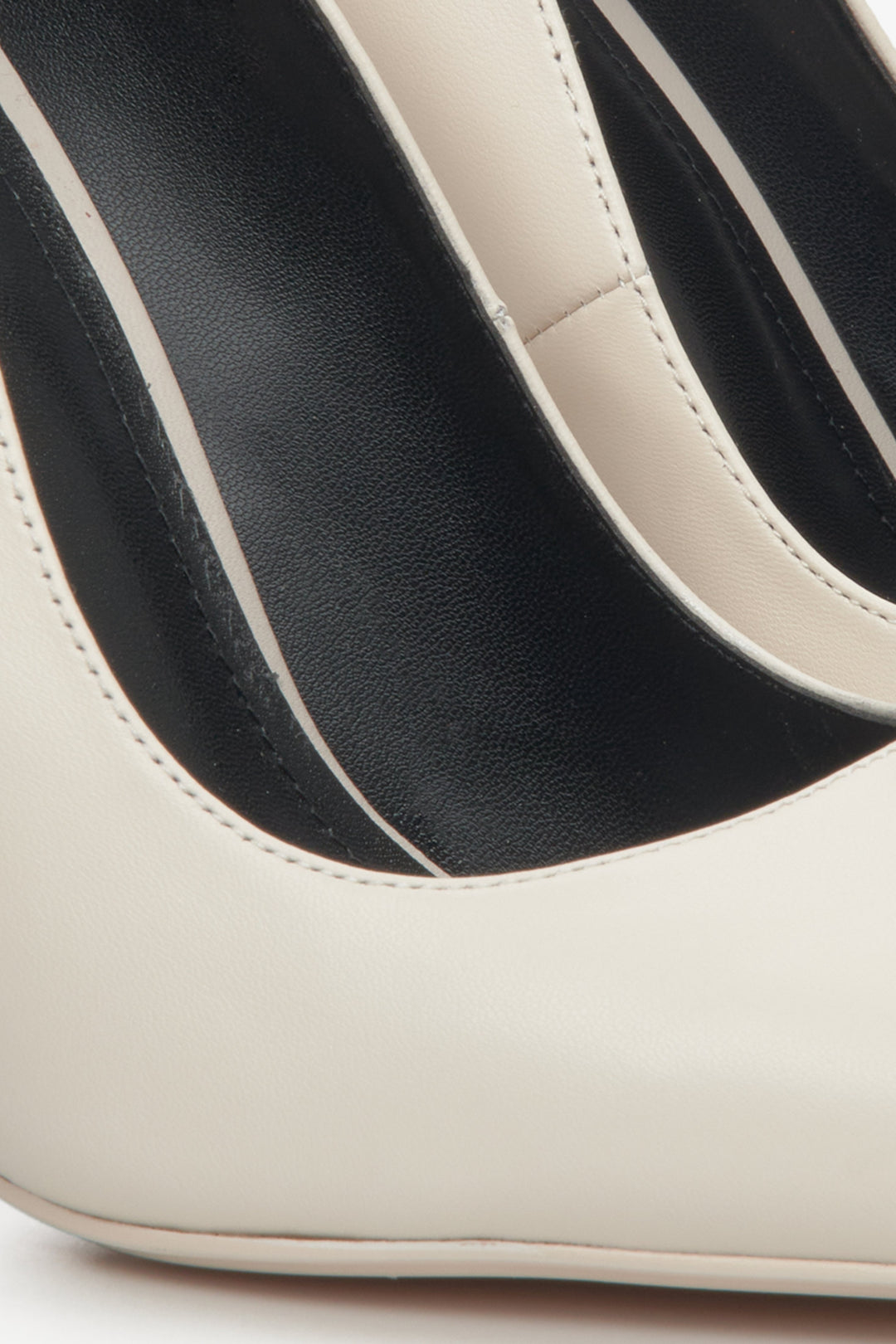 Women's white high heels by Estro - close-up on the details.