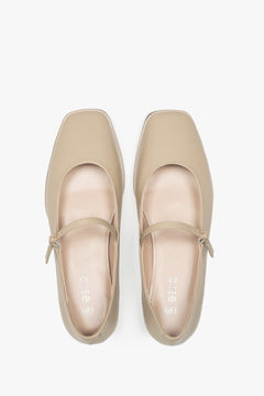 Women's beige moccasins with a buckle by Estro - top view presentation.