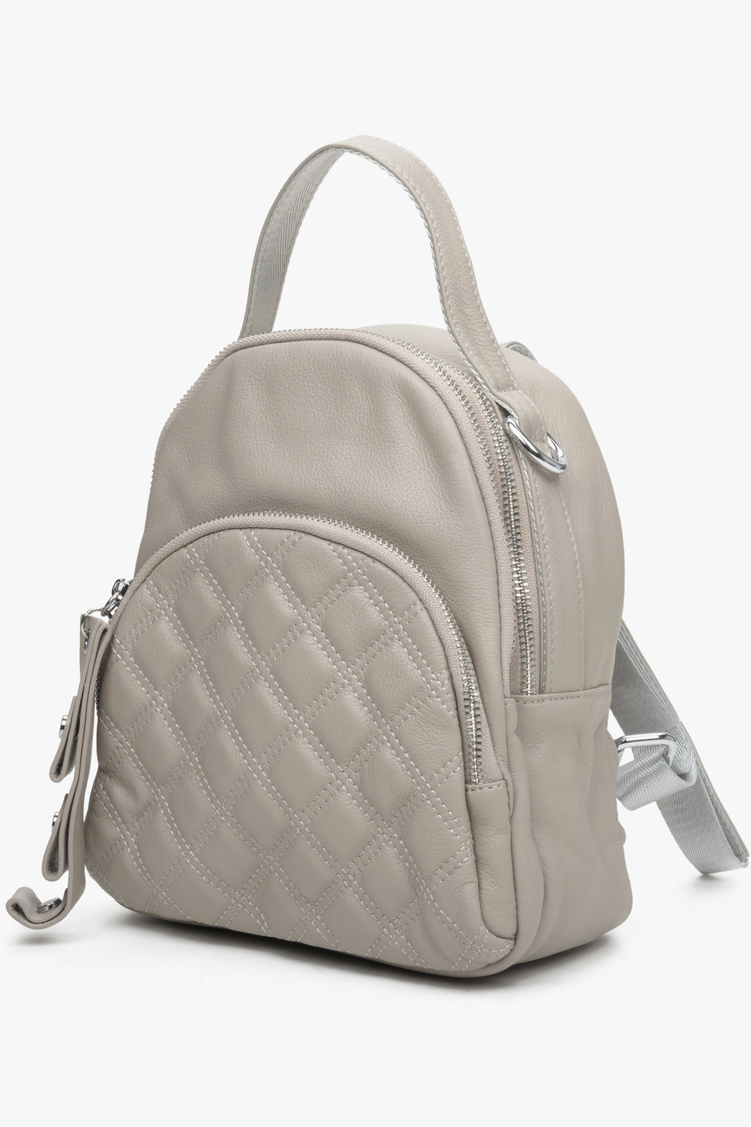 Small, urban women's beige backpack by Estro - front view of the model.