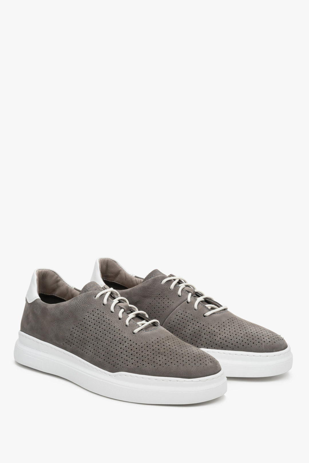 Grey men's nubuck sneakers with perforation for summer - presentation of the toe and side seam of the shoe.