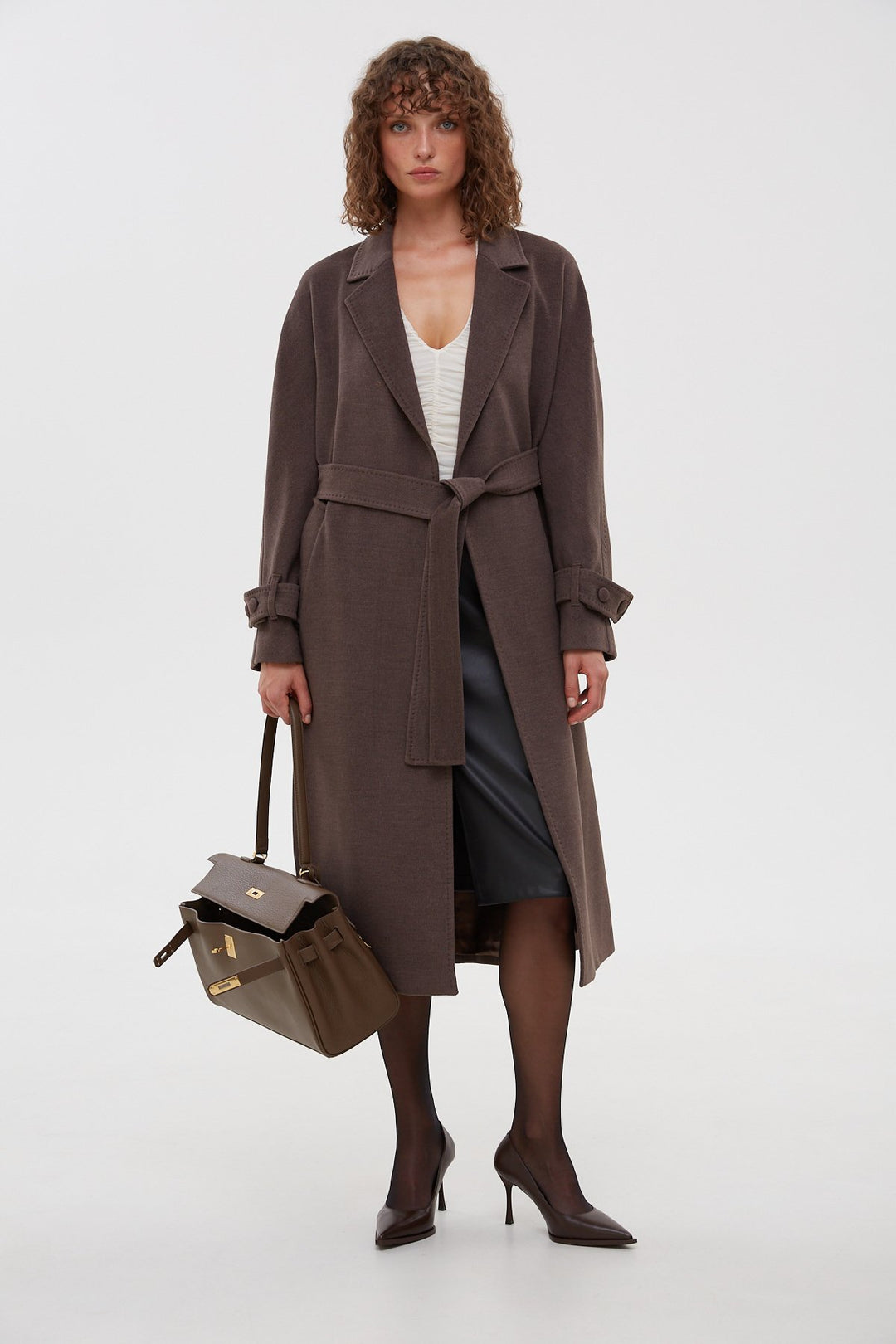 Classic women's saddle brown coat with a belt by Estro.