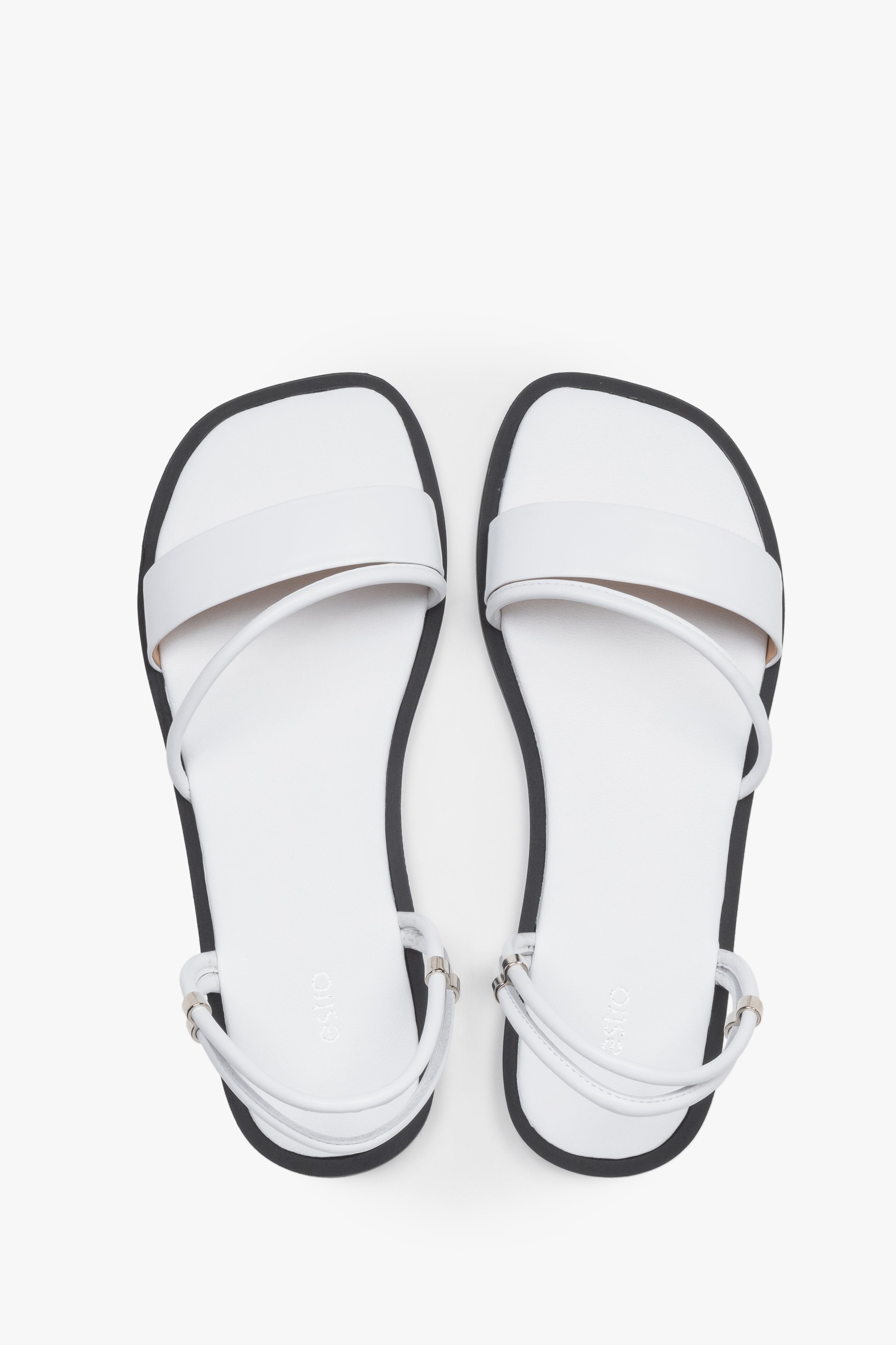 Women’s lightweight white sandals with thin straps made of genuine leather by Estro – top view.