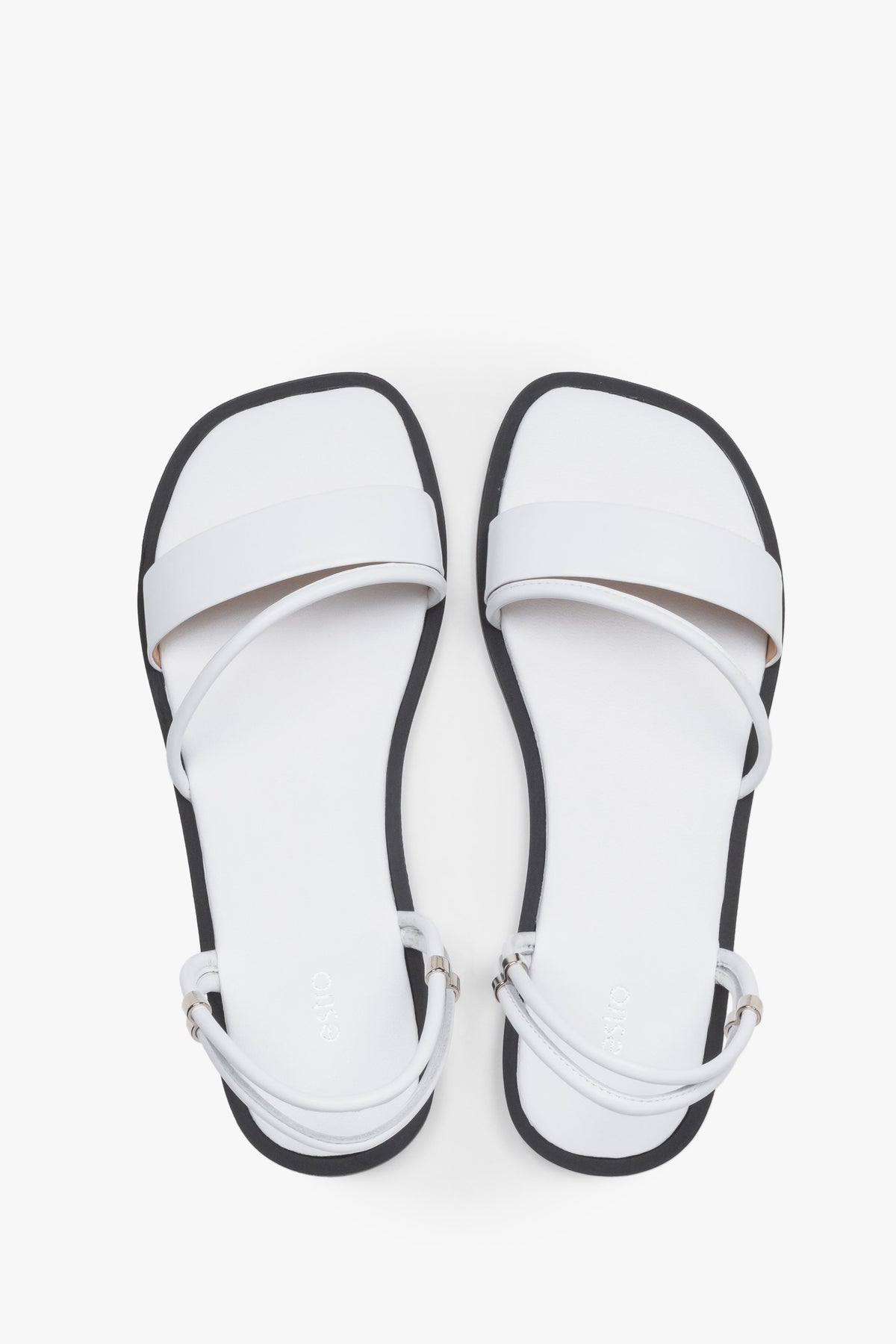 Women’s lightweight white sandals with thin straps made of genuine leather by Estro – top view.