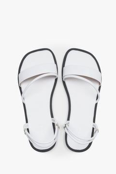 Women’s lightweight white sandals with thin straps made of genuine leather by Estro – top view.