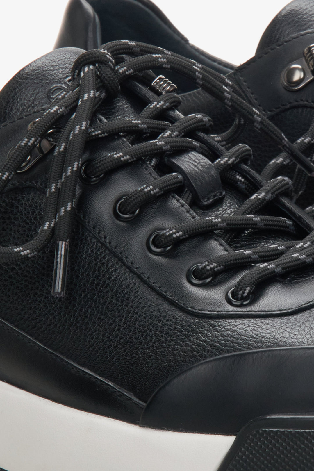 Men's black leather sneakers by Estro - close-up on the details.