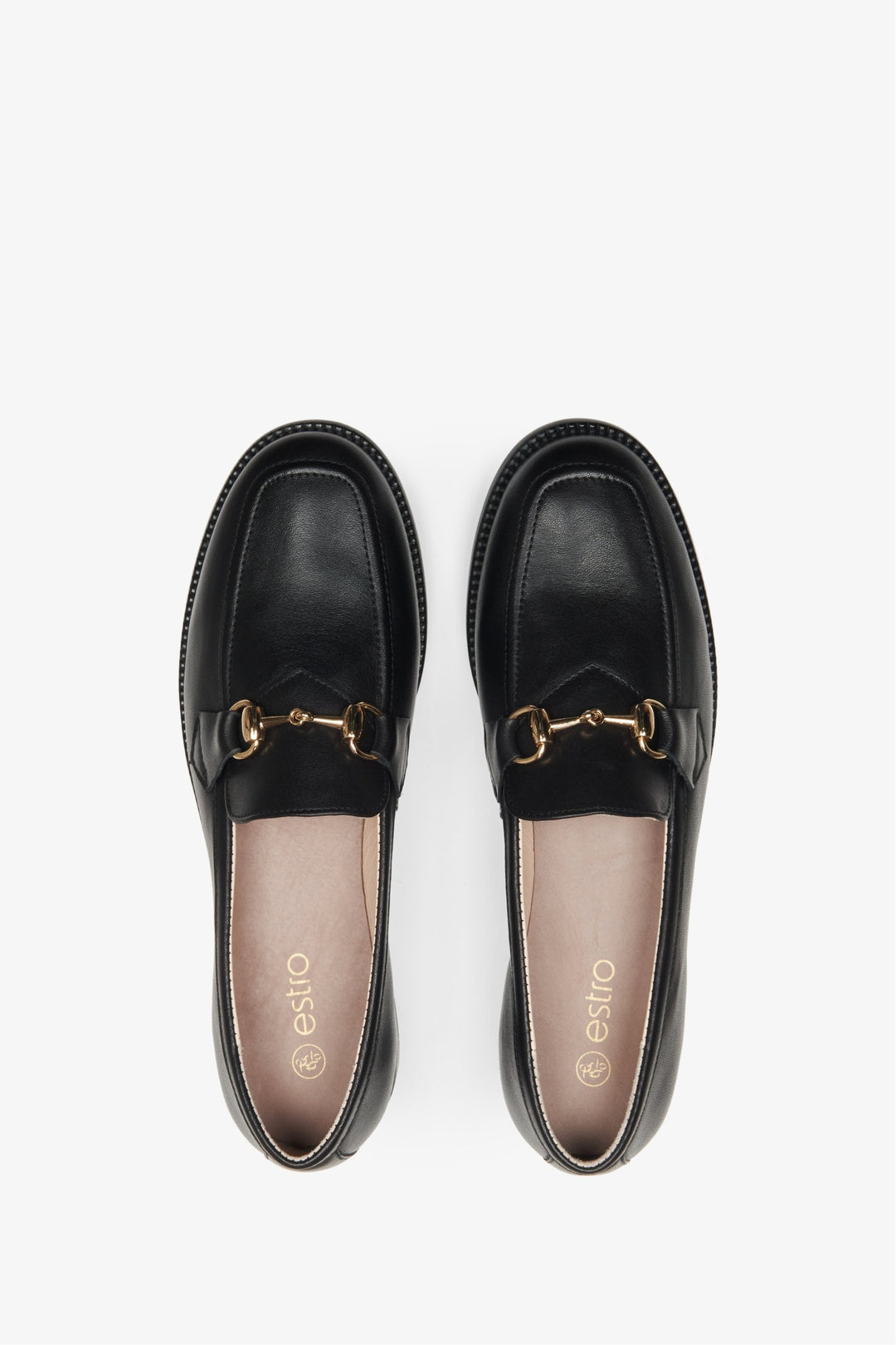 Elegant, black women's loafers made of Italian leather - close-up form above.