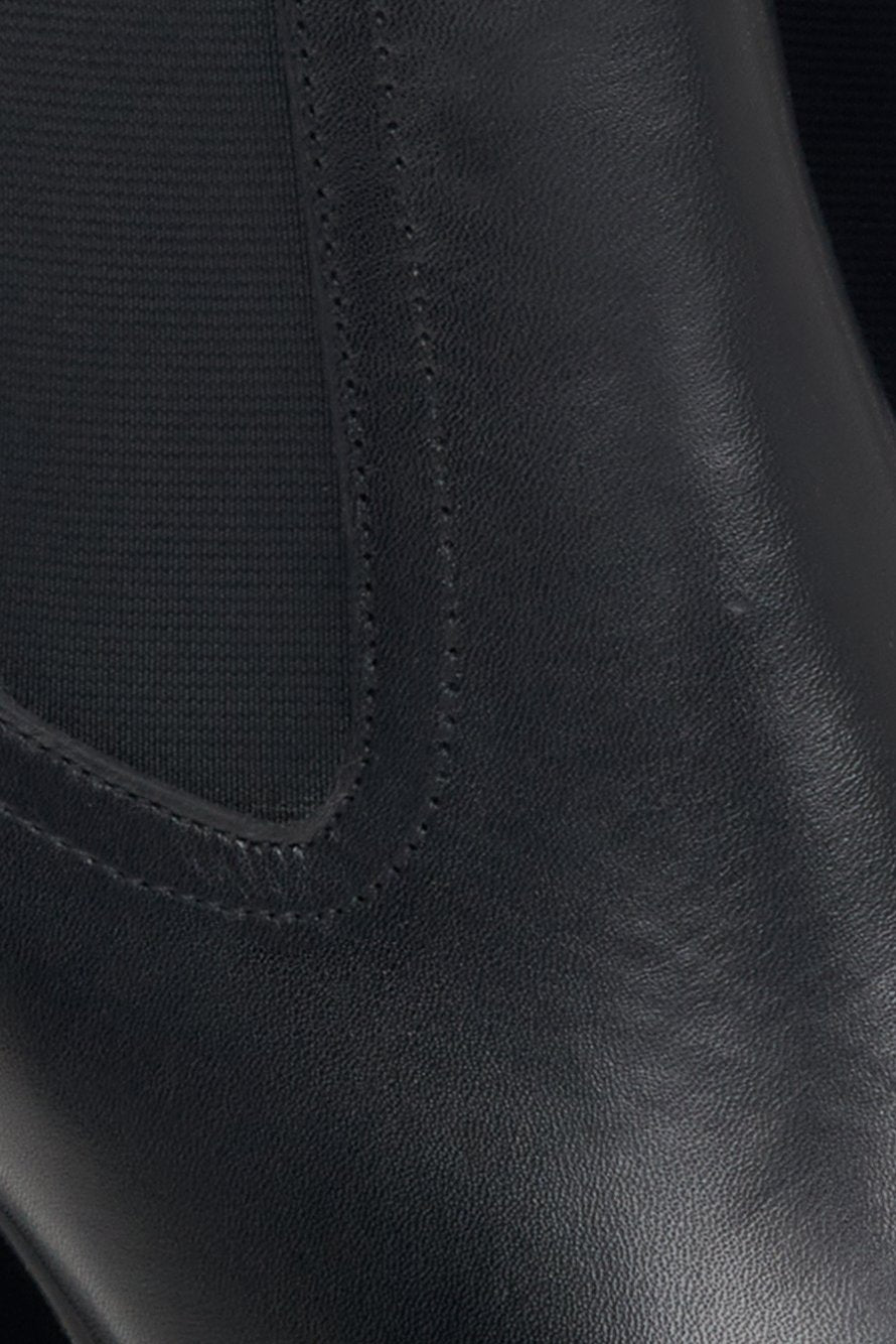 Women's black leather Estro boots - close-up on the details.