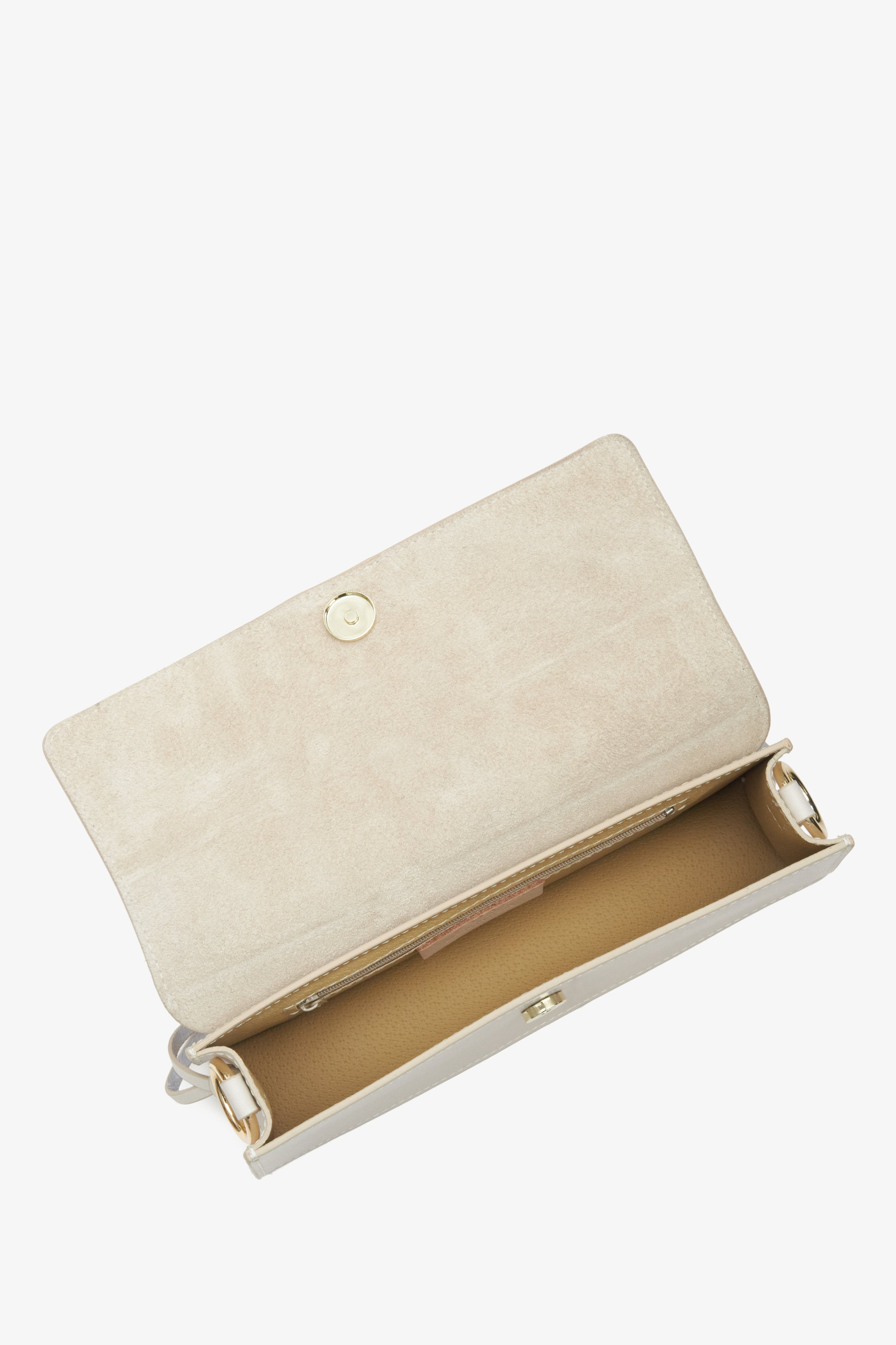 Women's cream beige leather handbag - a close-up on the main compartment.