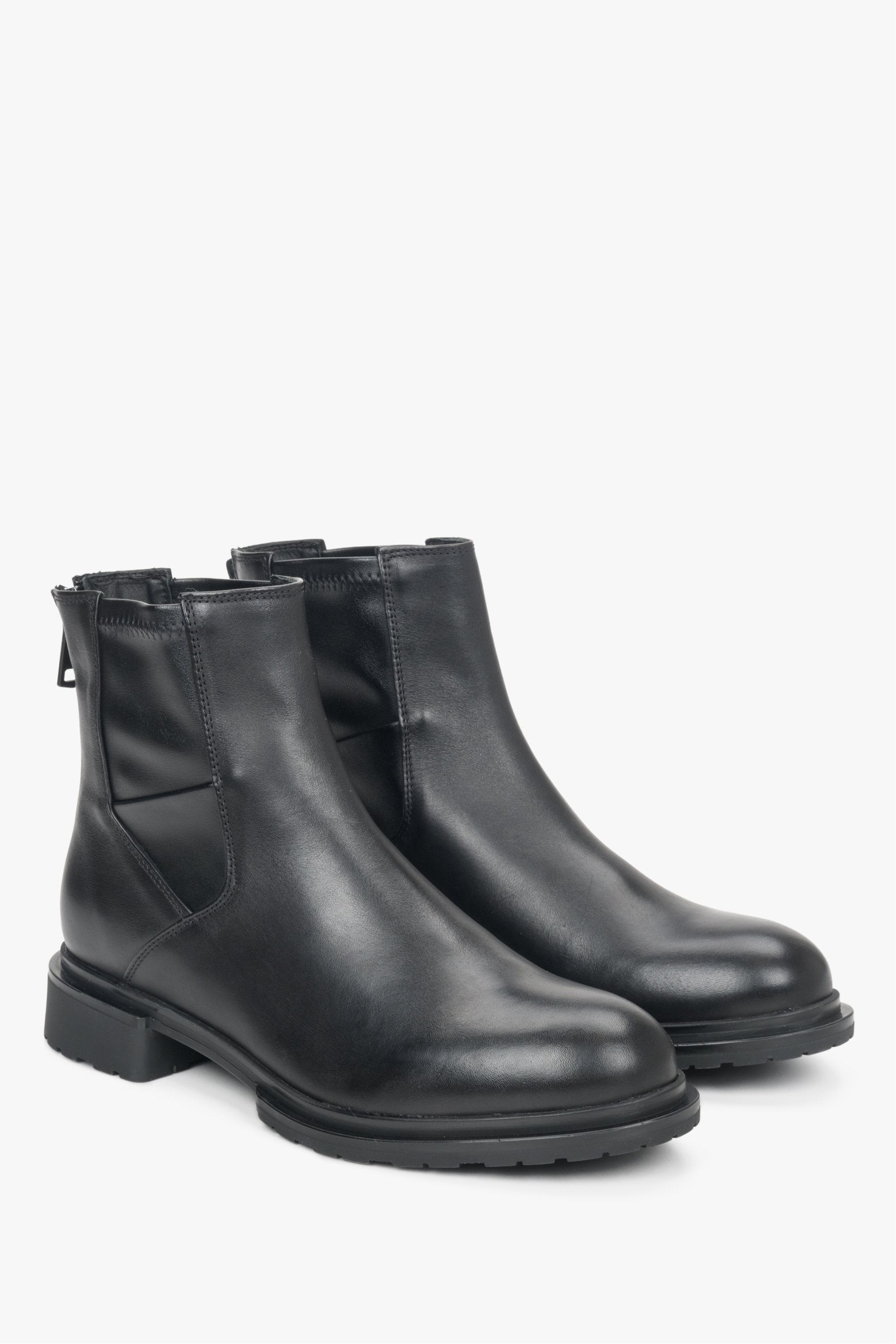 Black leather boots with a zipper by Estro.