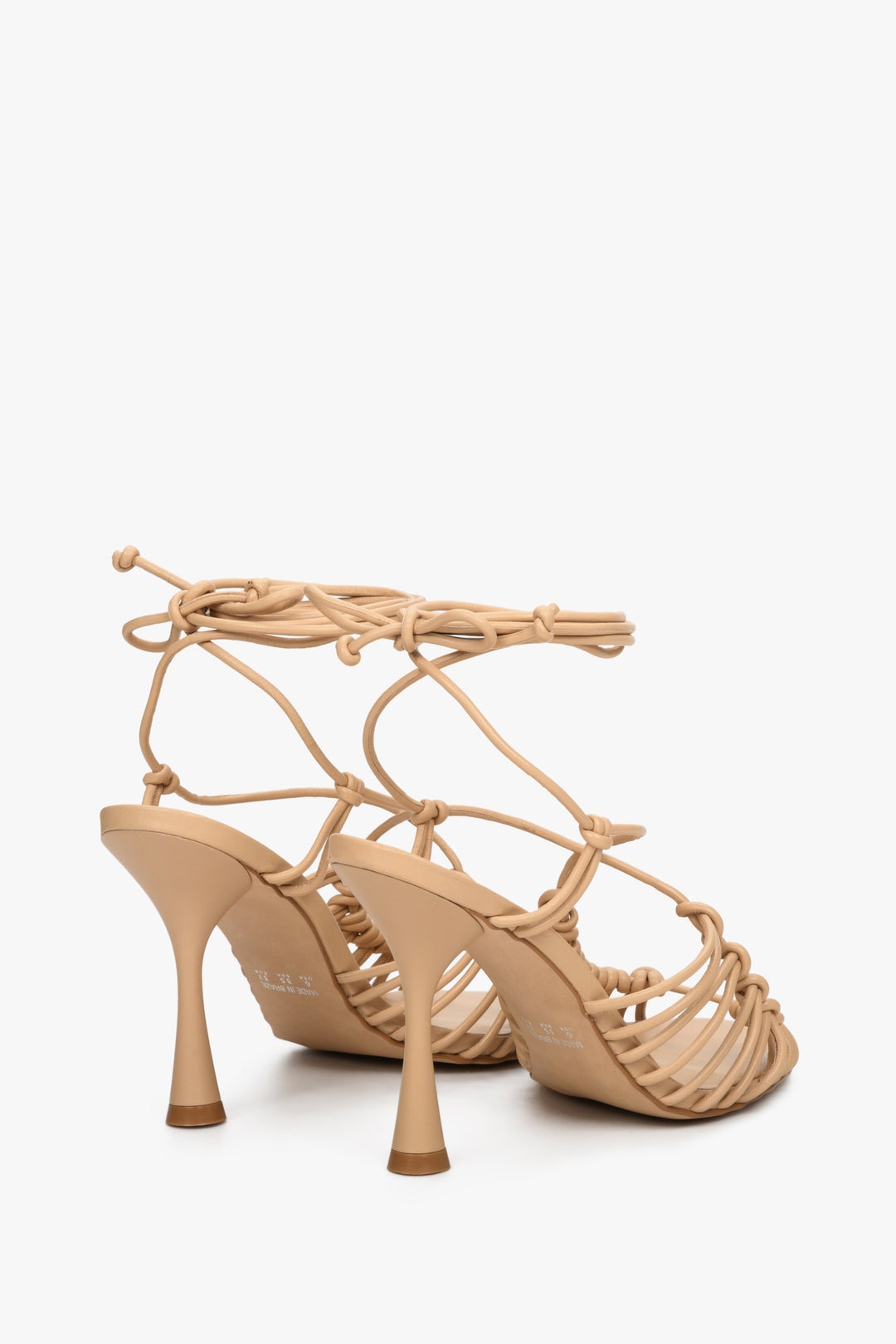 Beige, laced, woven women's high heel sandals by Estro - close-up on the back of the shoe.