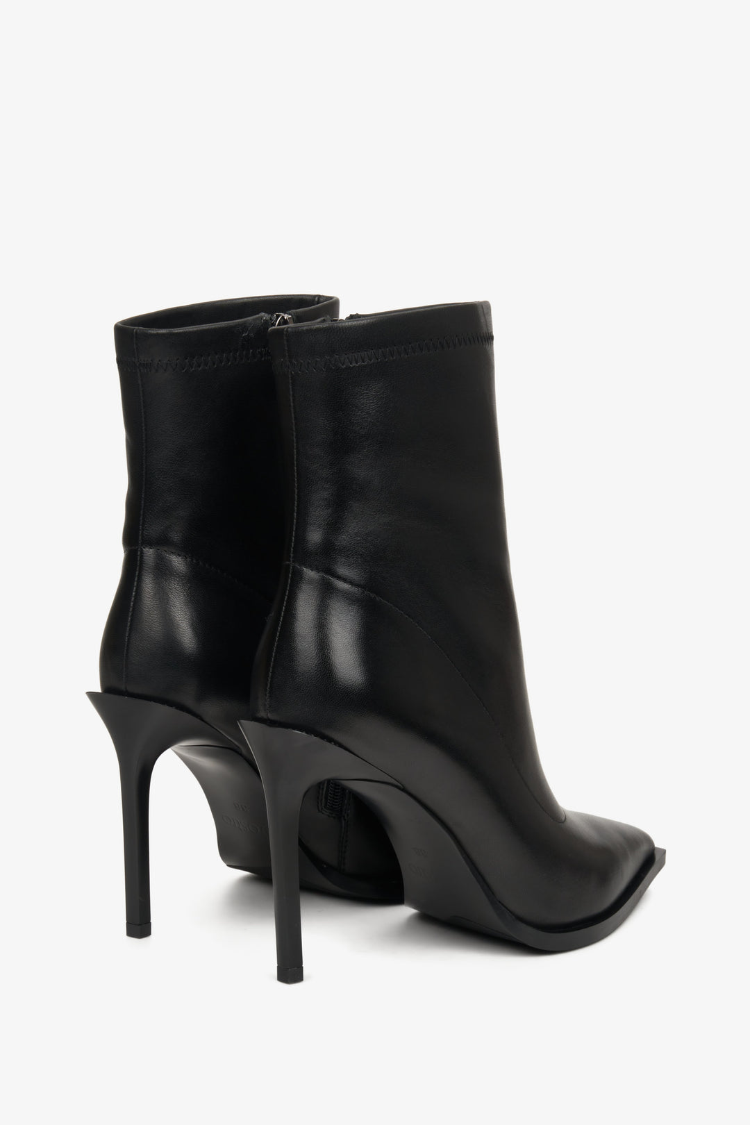 High women's boots made of black genuine leather by Estro - close-up of the shoe heel.