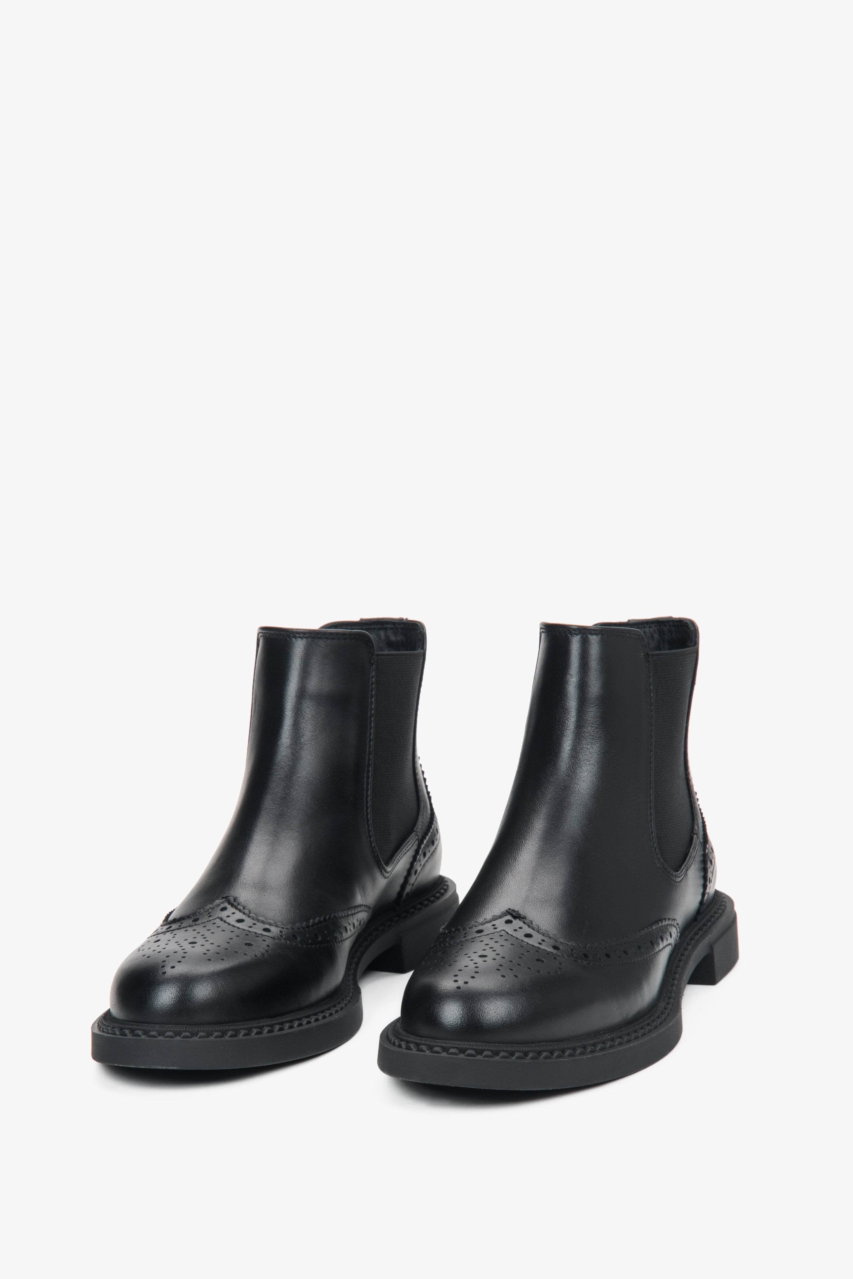 Low-cut black perforated Chelsea boots for women, crafted from high-quality premium Italian leather.