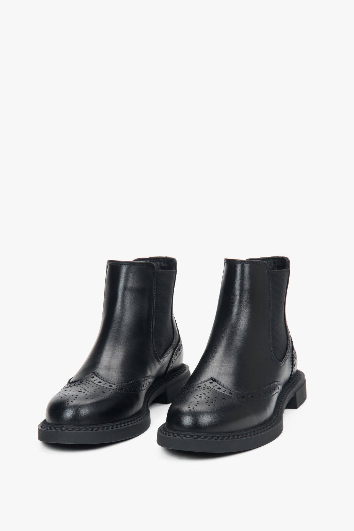Low-cut black perforated Chelsea boots for women, crafted from high-quality premium Italian leather.