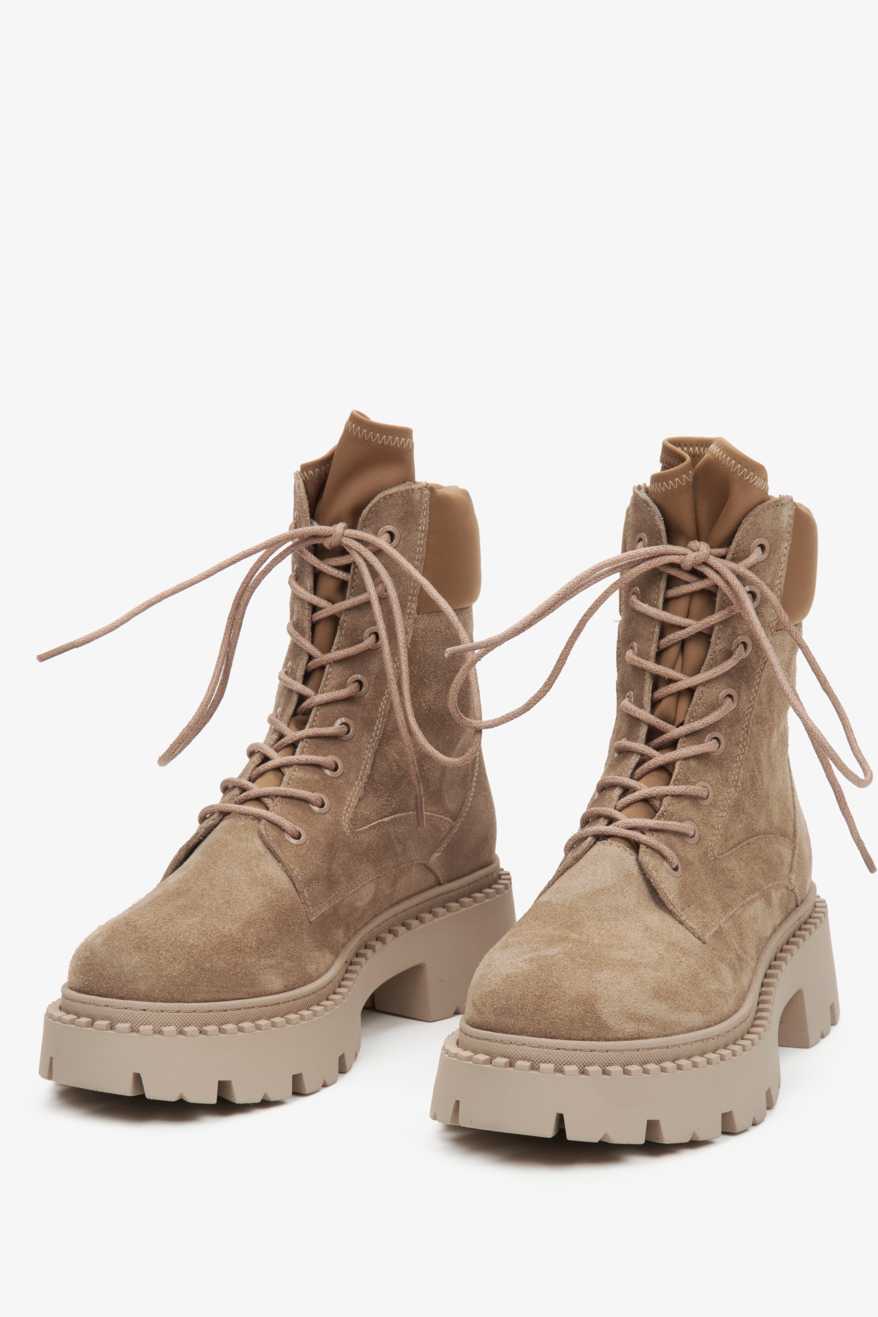 Beige lace-up women's ankle boots by Estro - front view of the model.