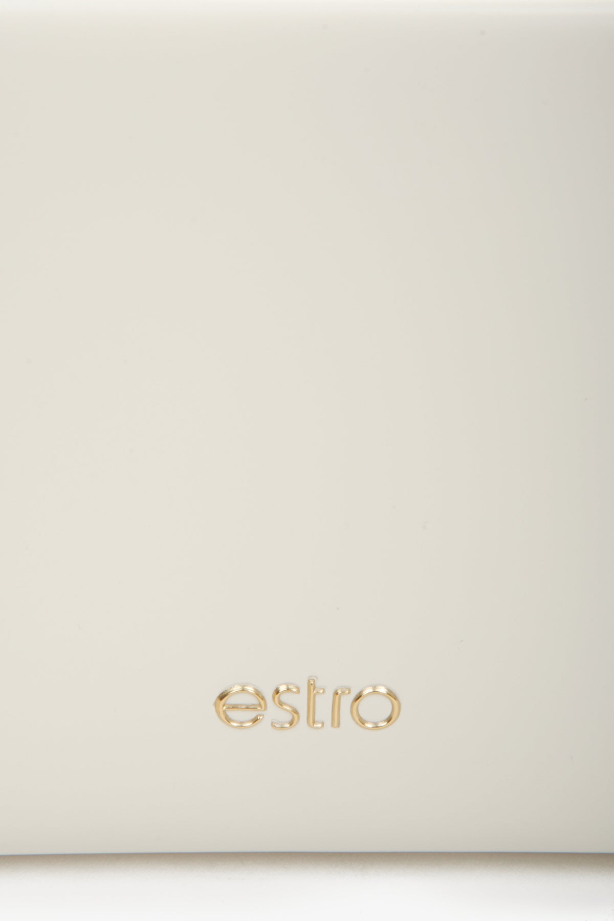 Women's light beige leather handbag - a close-up on details.