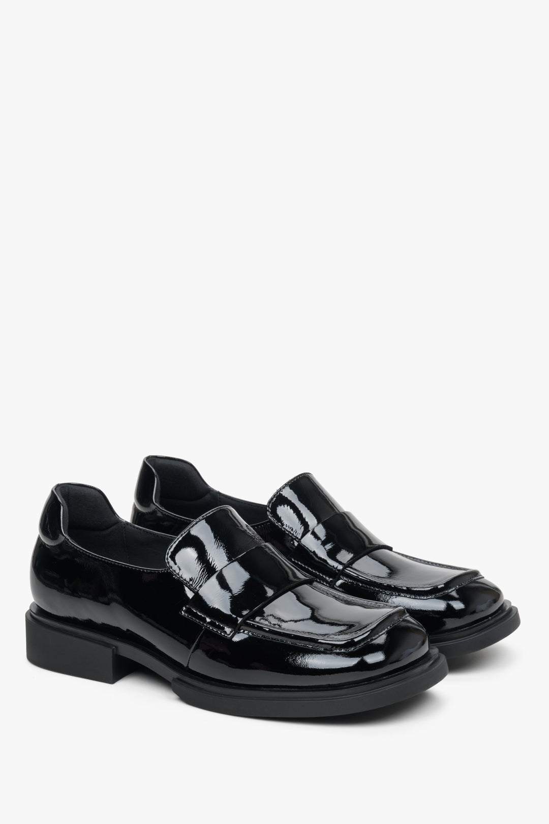 Women's black moccasins made of patent genuine leather by Estro.