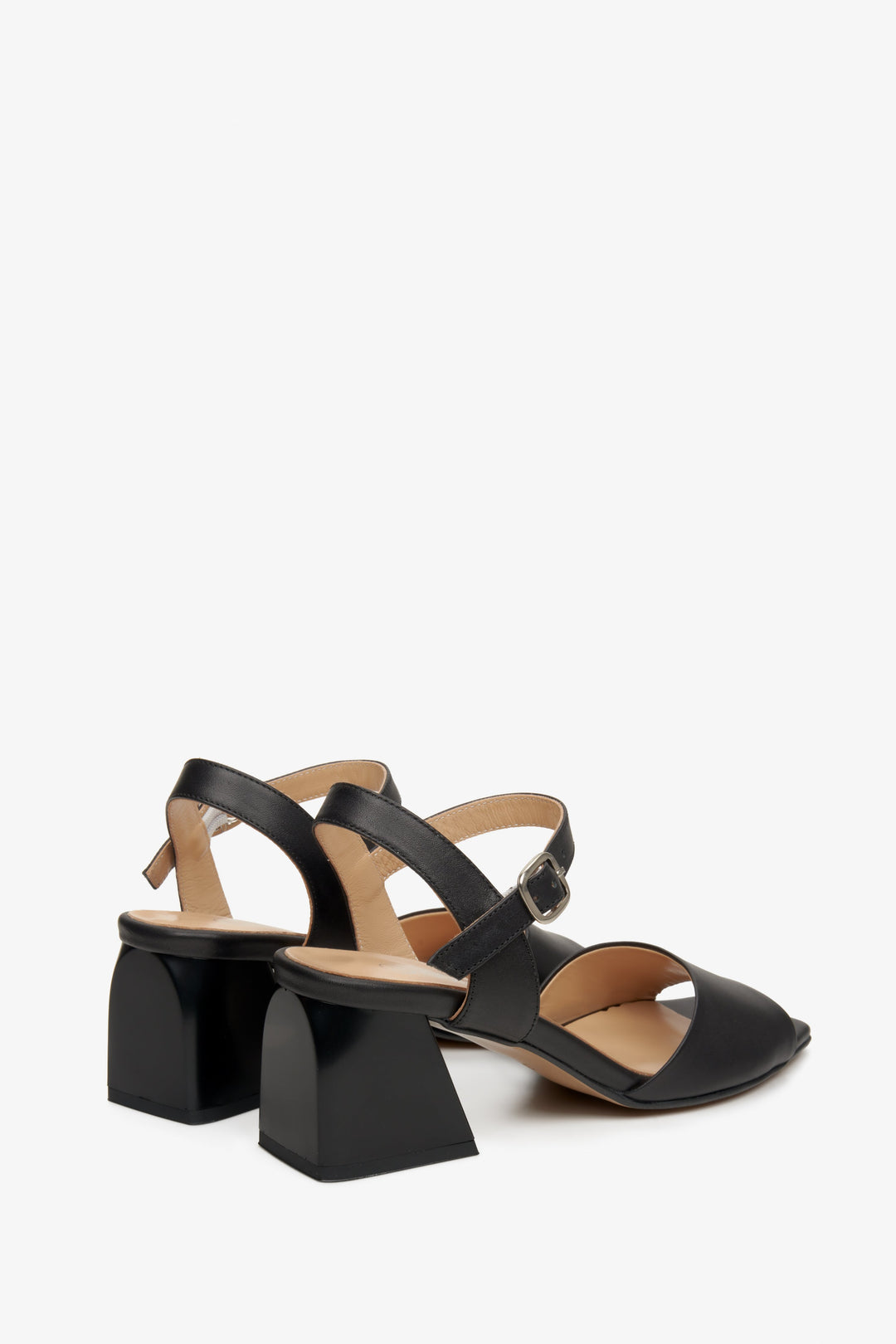 Women's black leather sandals by Estro - close-up on the block heel and side profile of the shoes.