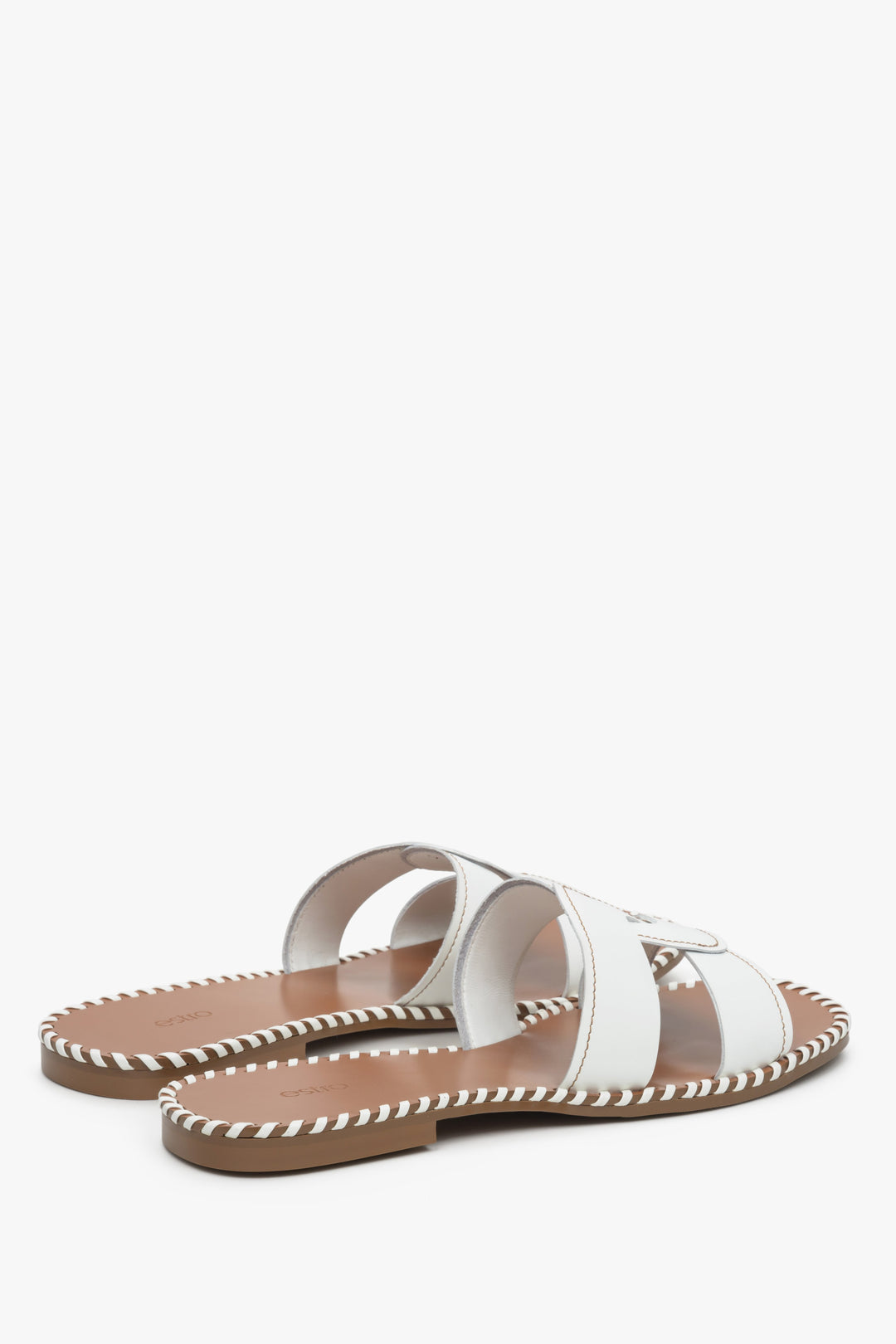 Women's white leather slide sandals.
