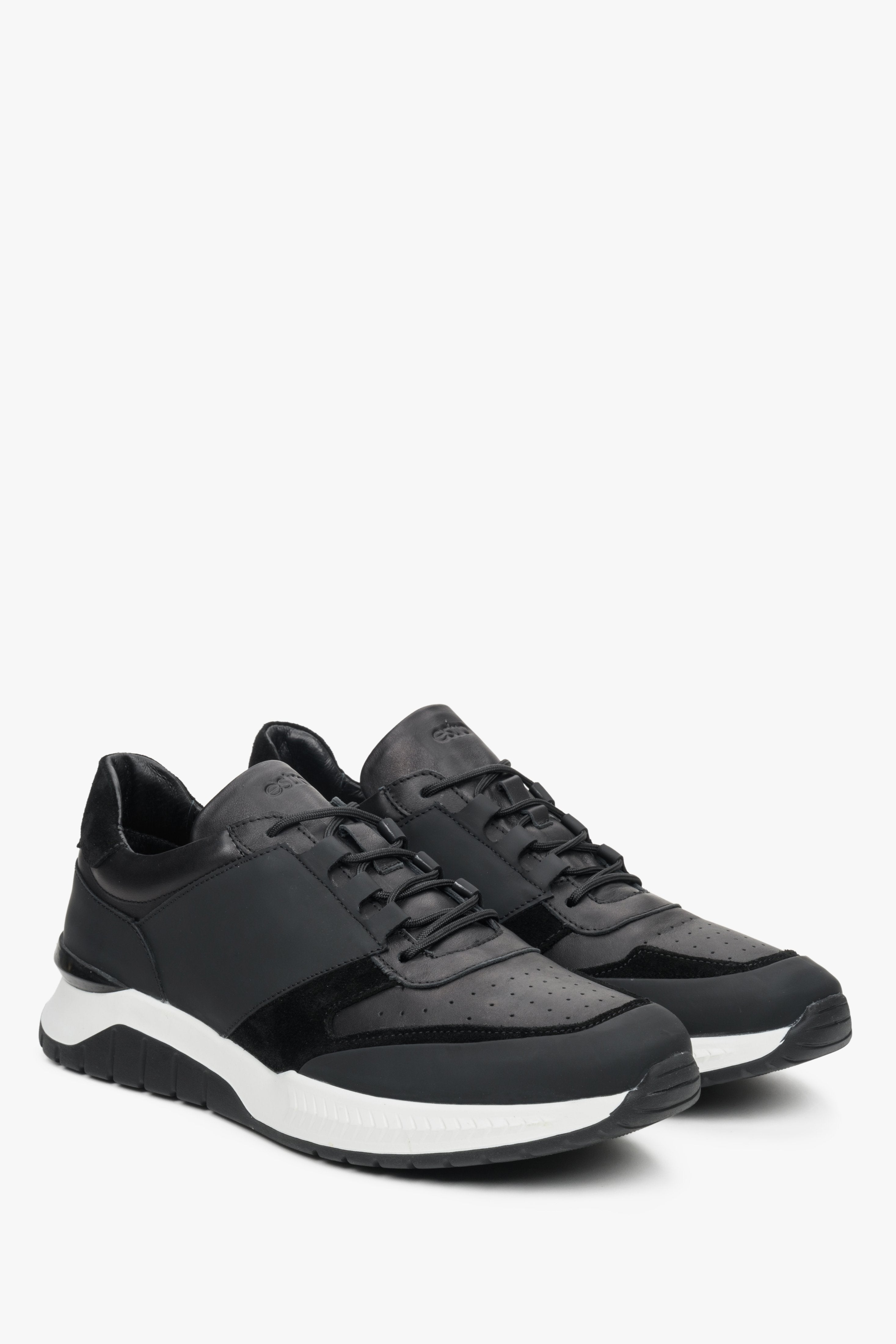 Men's black and white sneakers by Estro - front and side seam view of the shoe.