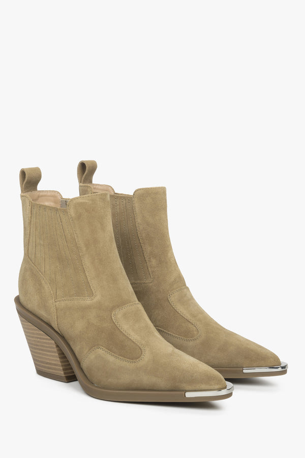 Beige velour women's cowboy boots.