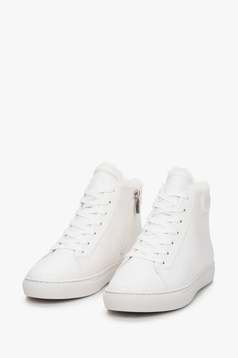 White high-top women's sneakers made of genuine leather by Estro - close-up on the front part of the shoe.