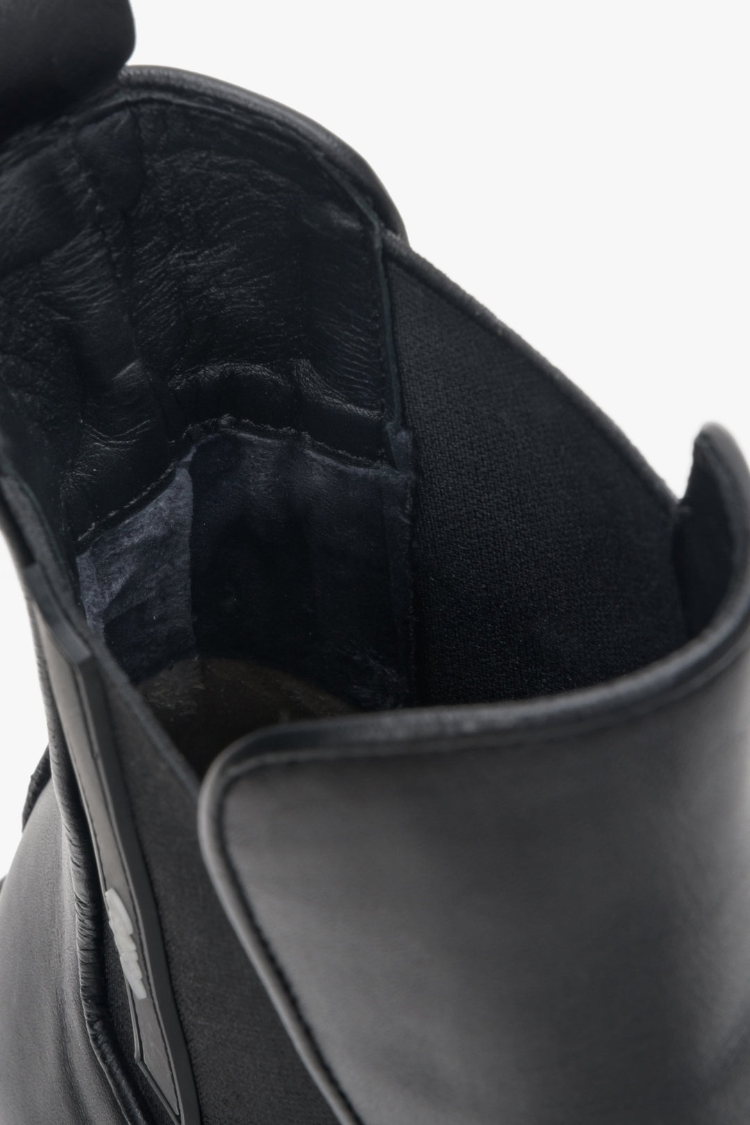 Women's black leather  ankle boots by Estro - close-up to the inside of the model.