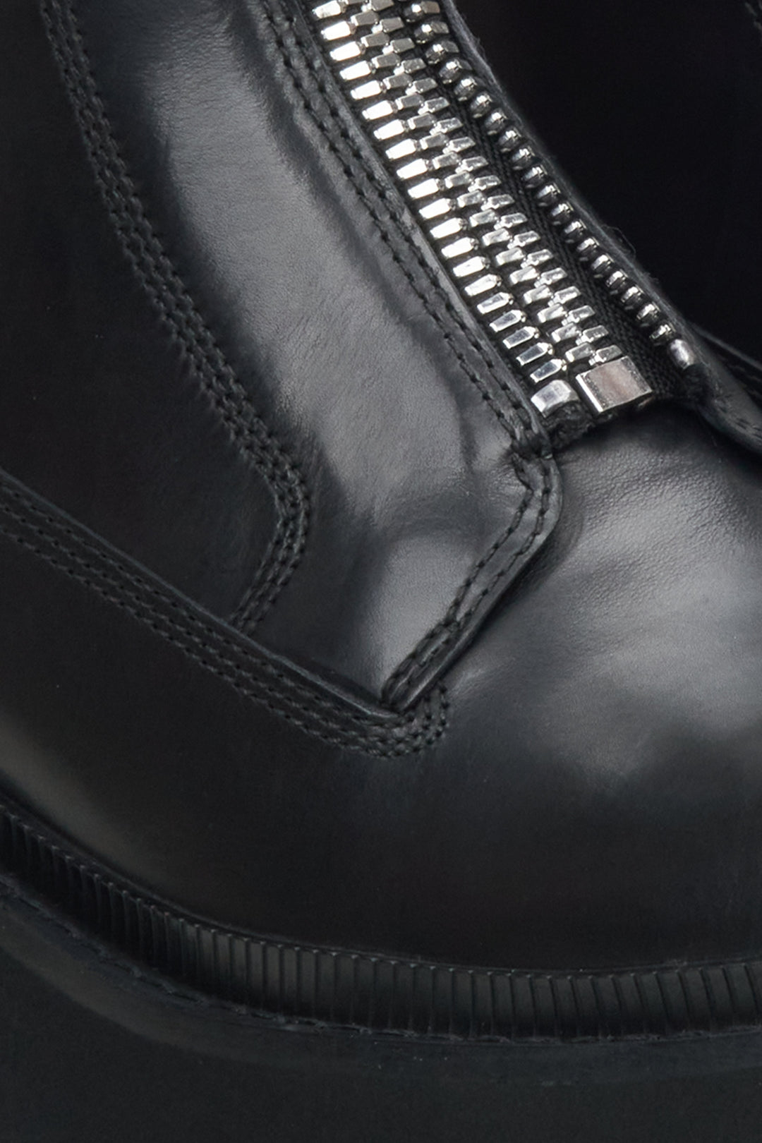 Women's black leather boots by Estro - close-up on details.