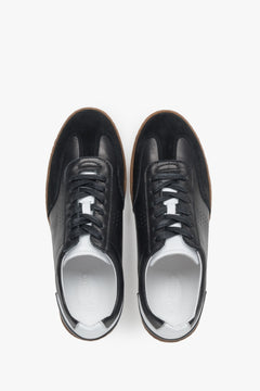 Stylish black men's sneakers made from a combination of genuine leather and velour.