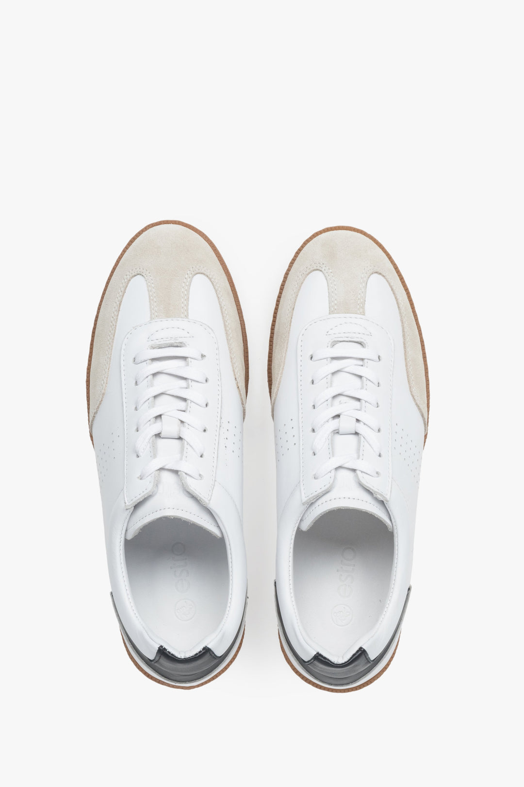 Stylish white men's sneakers made of velour and genuine leather – top view.