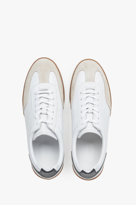 Stylish white men's sneakers made of velour and genuine leather – top view.