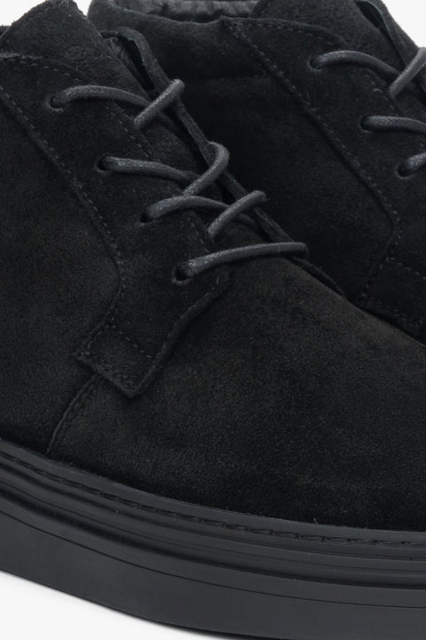 Comfortable and elegant men's black boots made of genuine velour with short lacing and a flexible thermoplastic rubber sole.