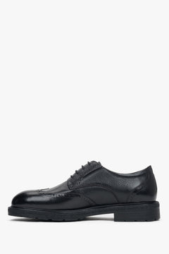 Side view highlighting decorative perforations and classic lace-up closure.