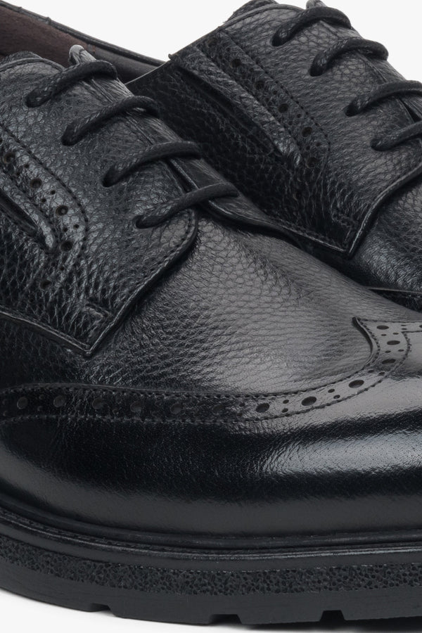 Durable rubber sole and flat heel ensuring stability and all-day comfort.