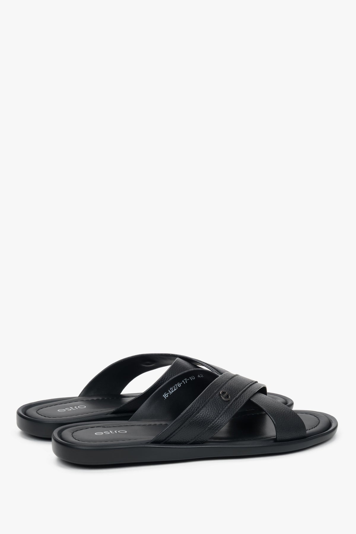 Comfortable flat leather sandals with subtle brand logo on the strap.