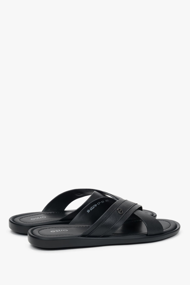 Comfortable flat leather sandals with subtle brand logo on the strap.
