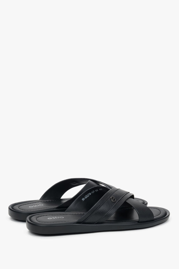 Comfortable flat leather sandals with subtle brand logo on the strap.