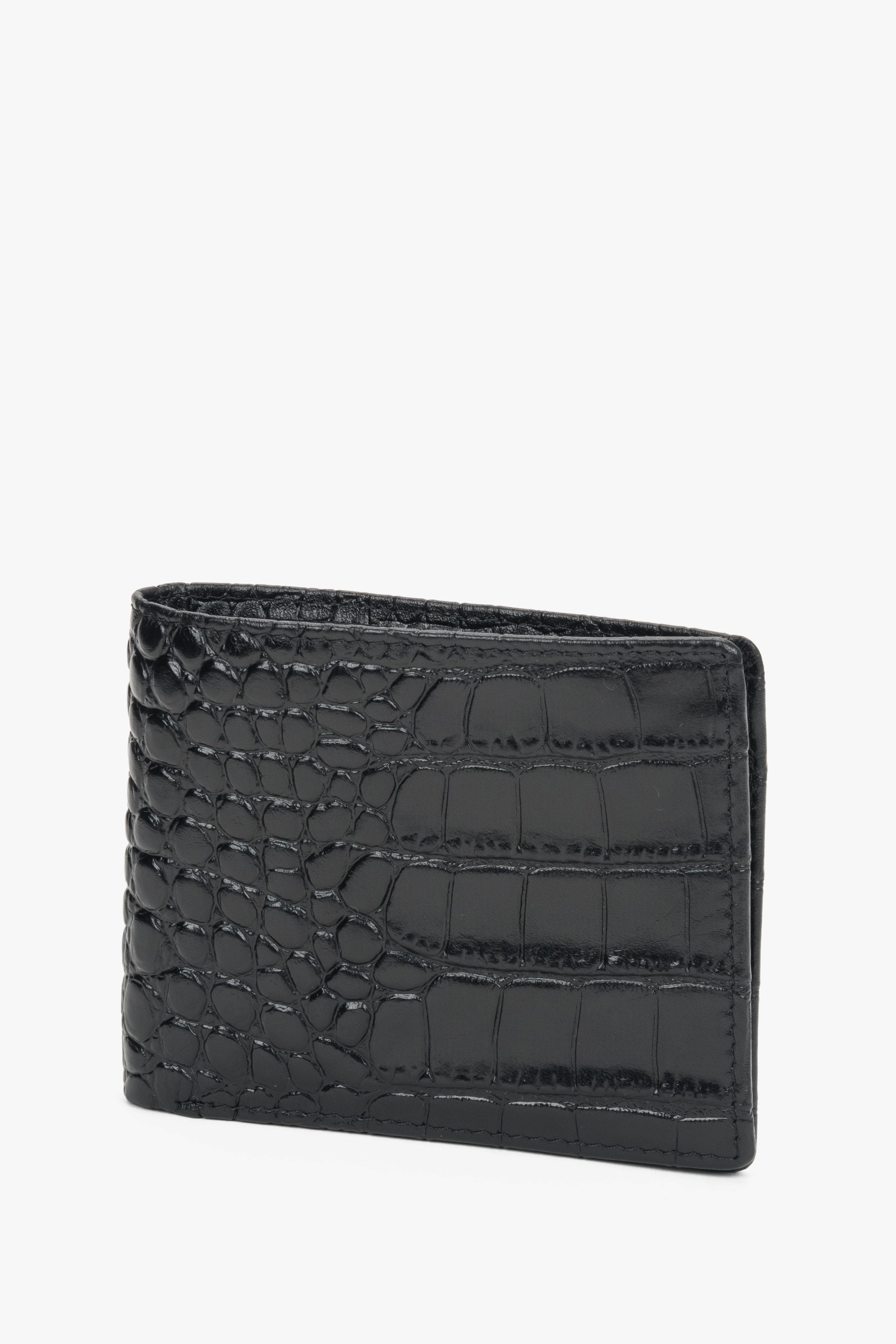 Close-up of black leather with crocodile-skin texture.

