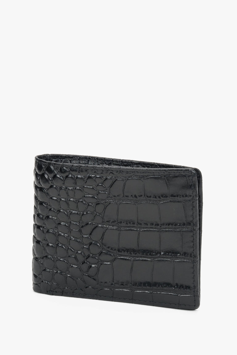 Close-up of black leather with crocodile-skin texture.
