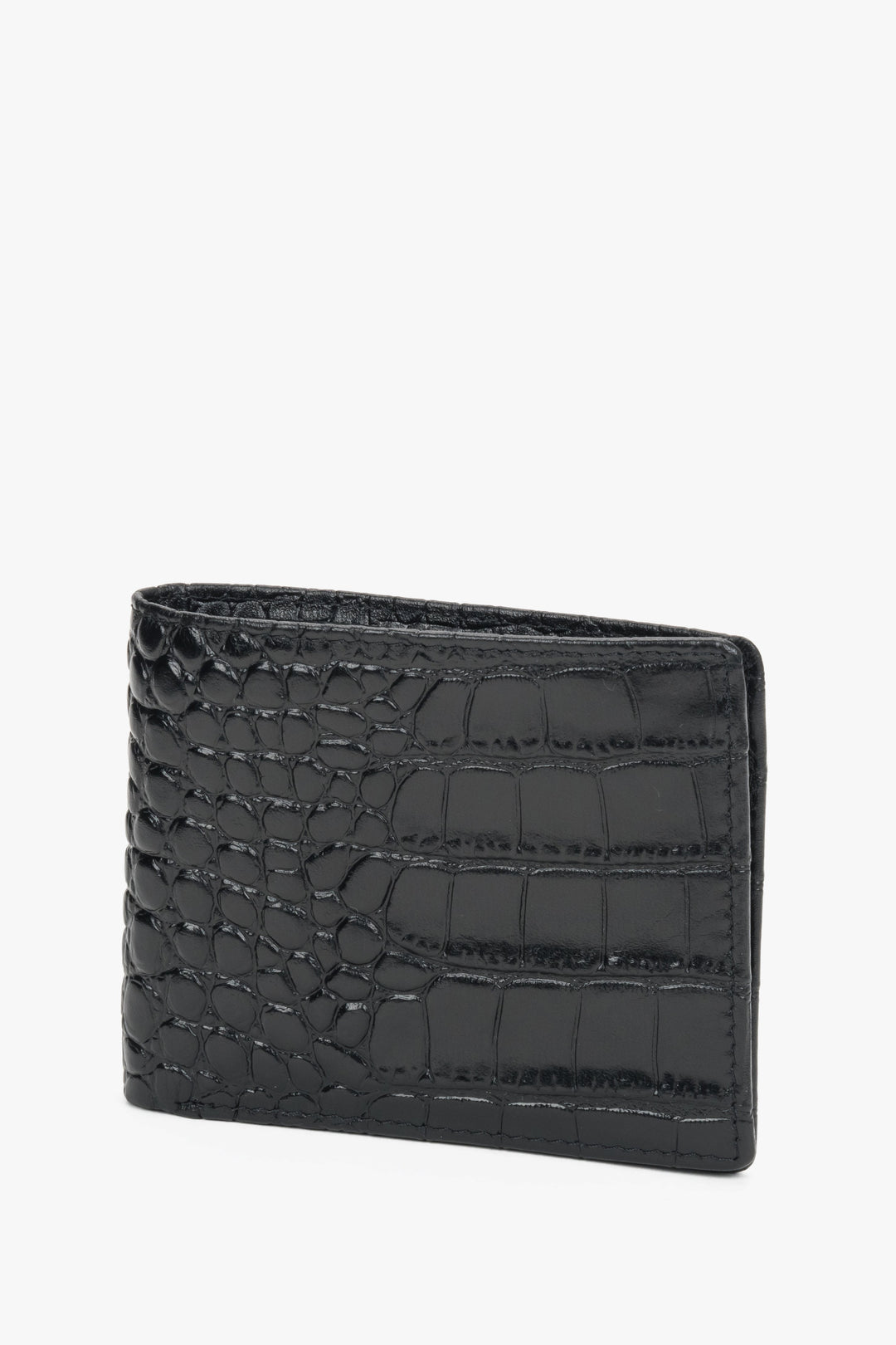 Close-up of black leather with crocodile-skin texture.
