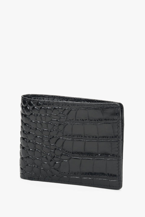 Close-up of black leather with crocodile-skin texture.
