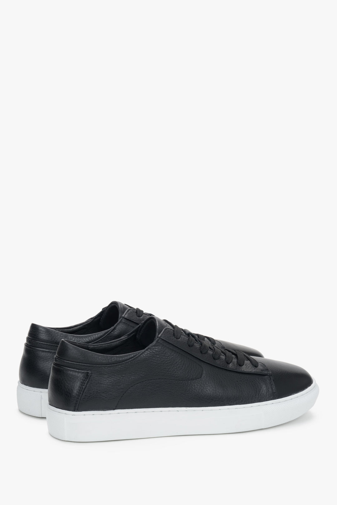 Stylish black leather sneakers with a modern contrasting outsole.