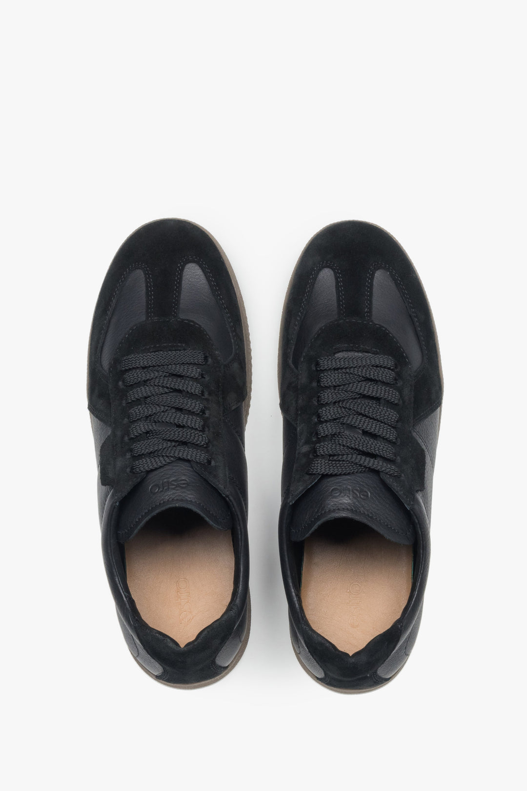 Black men’s leather and velour sneakers.