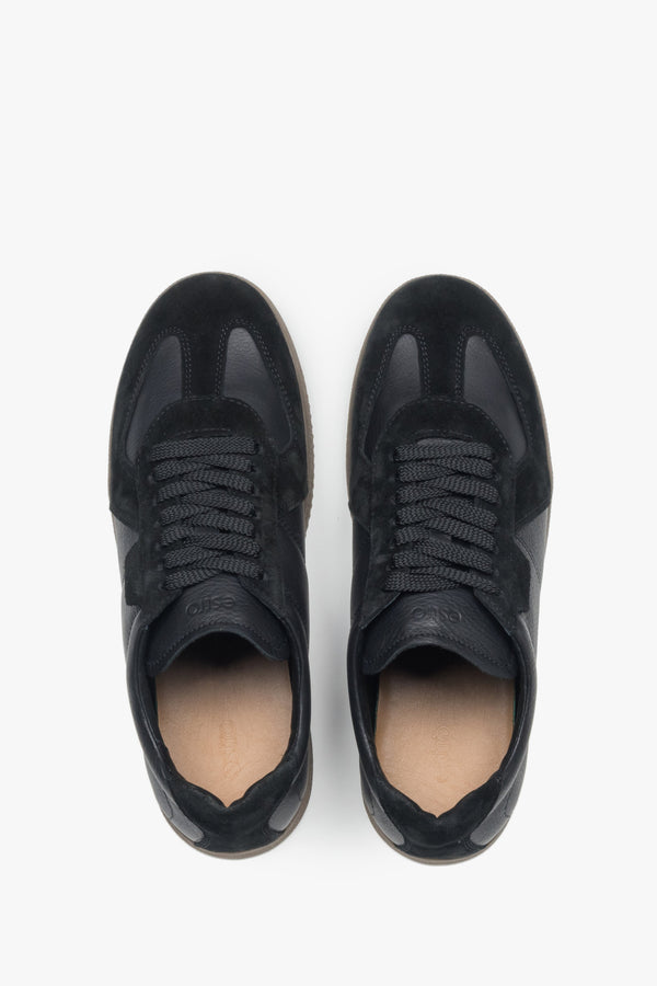 Black men’s leather and velour sneakers.