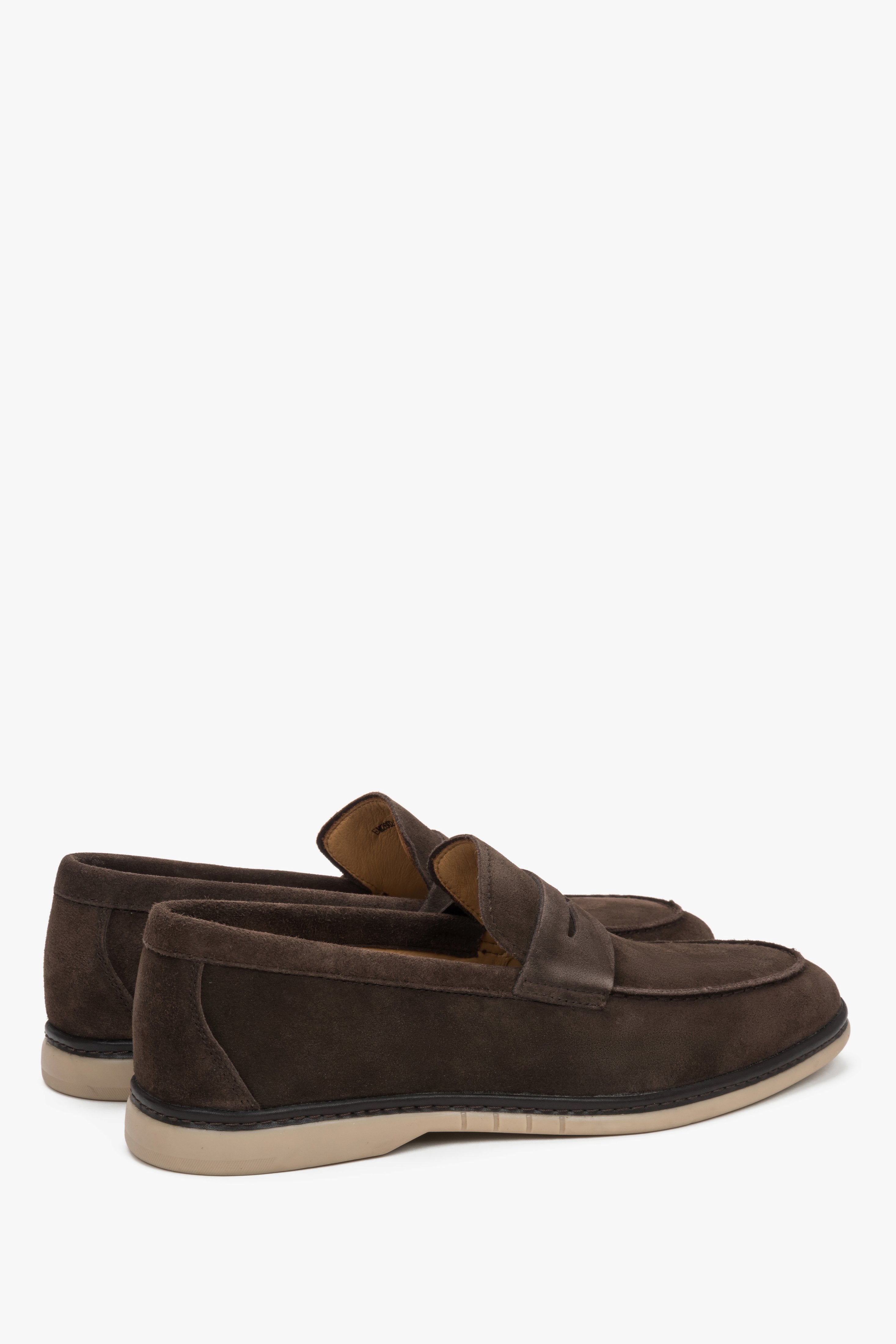 Close-up of the decorative stitching on dark brown natural velour loafers.