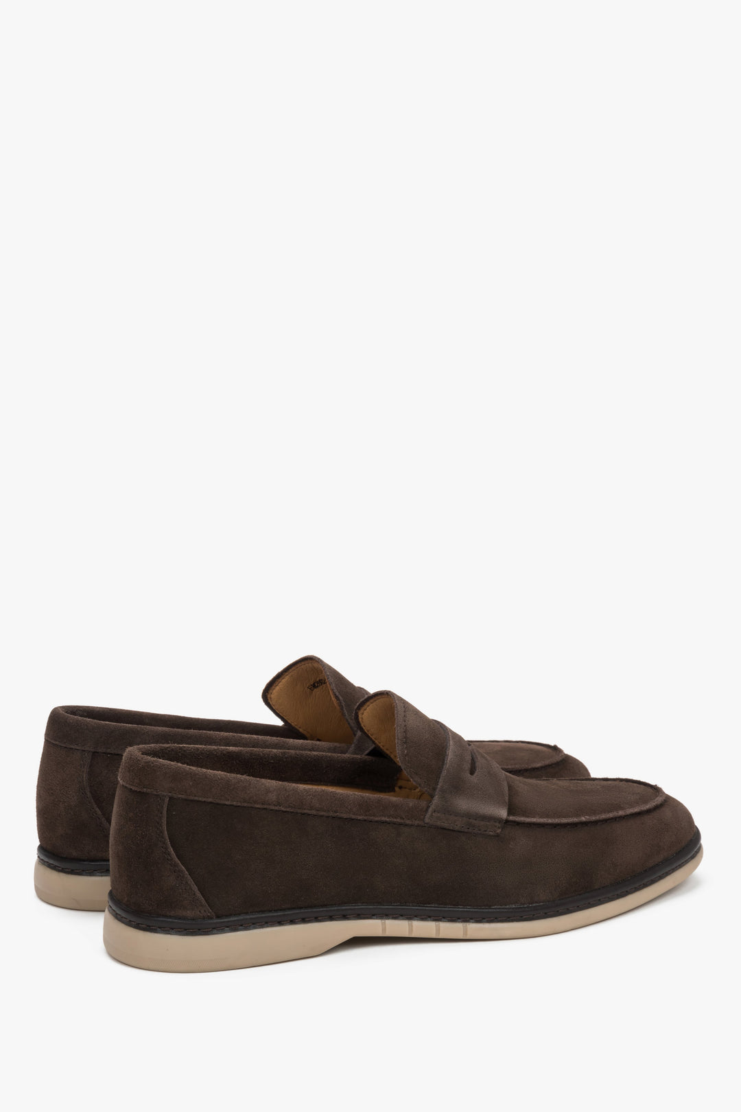 Close-up of the decorative stitching on dark brown natural velour loafers.
