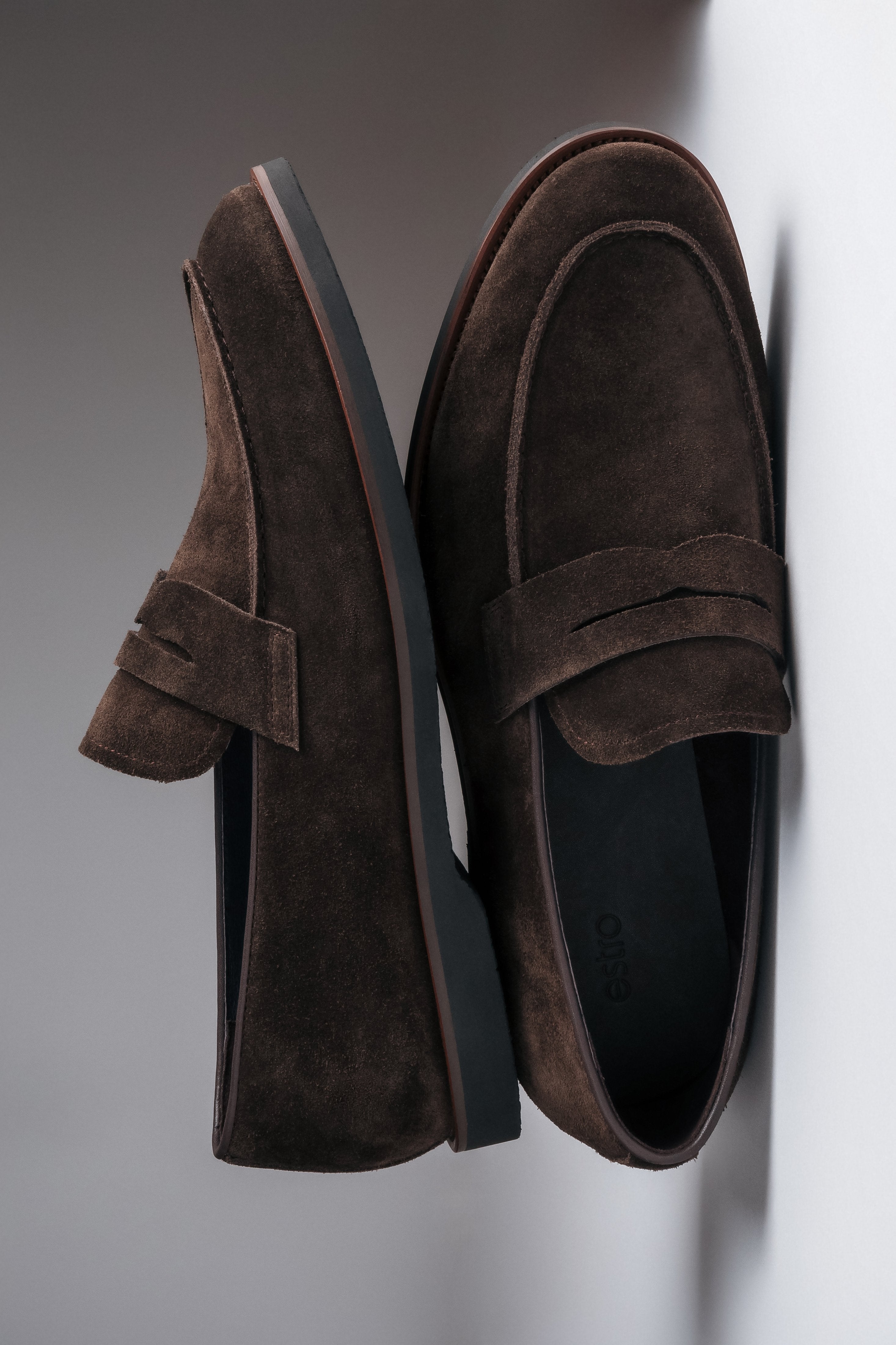 Stylish dark brown loafers with a flat rubber sole for spring and autumn.
